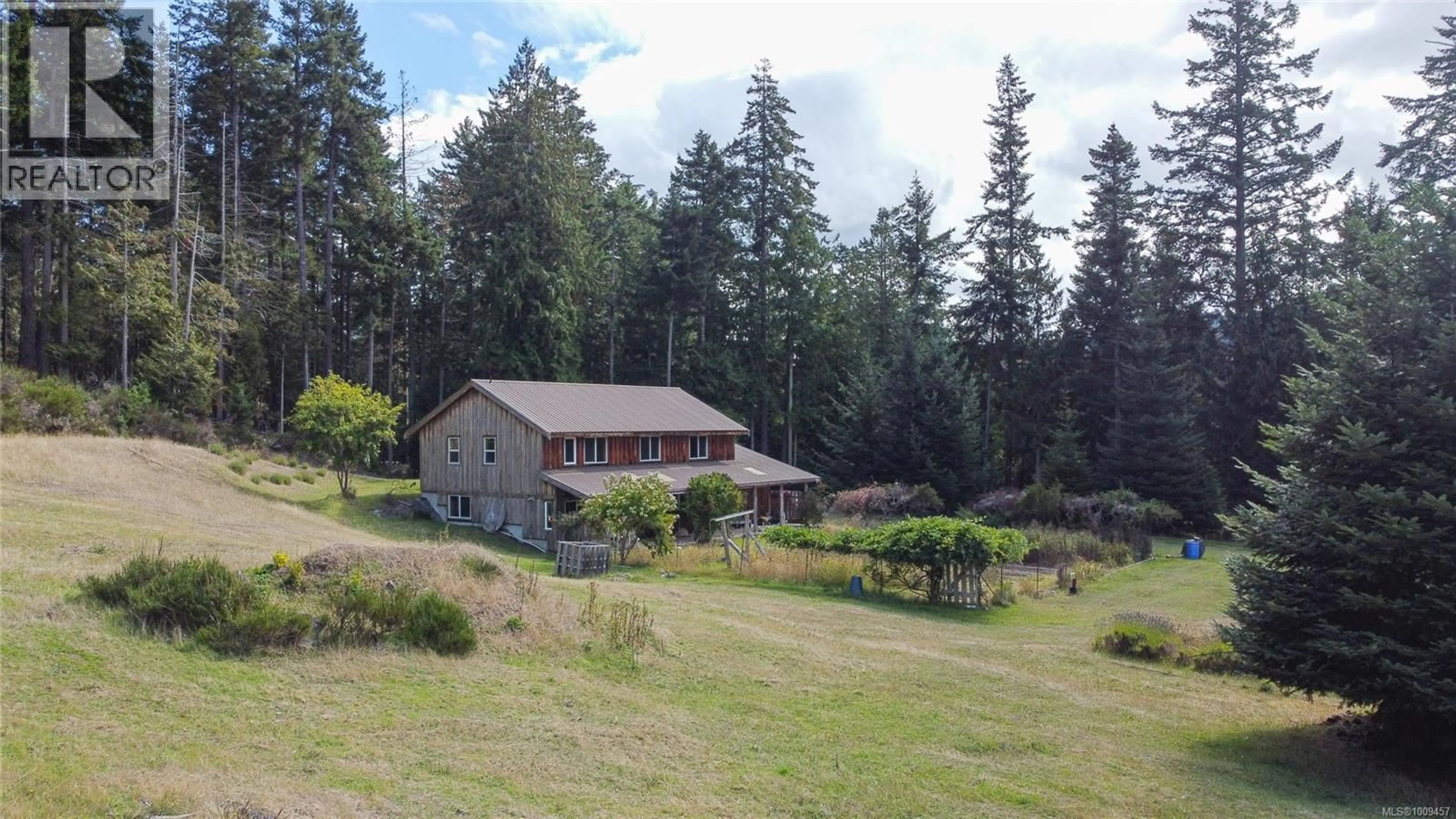 A pic from outside/outdoor area/front of a property/back of a property/a pic from drone, mountain view for 415 CAMPBELL BAY ROAD, Mayne Island British Columbia V0N2J0