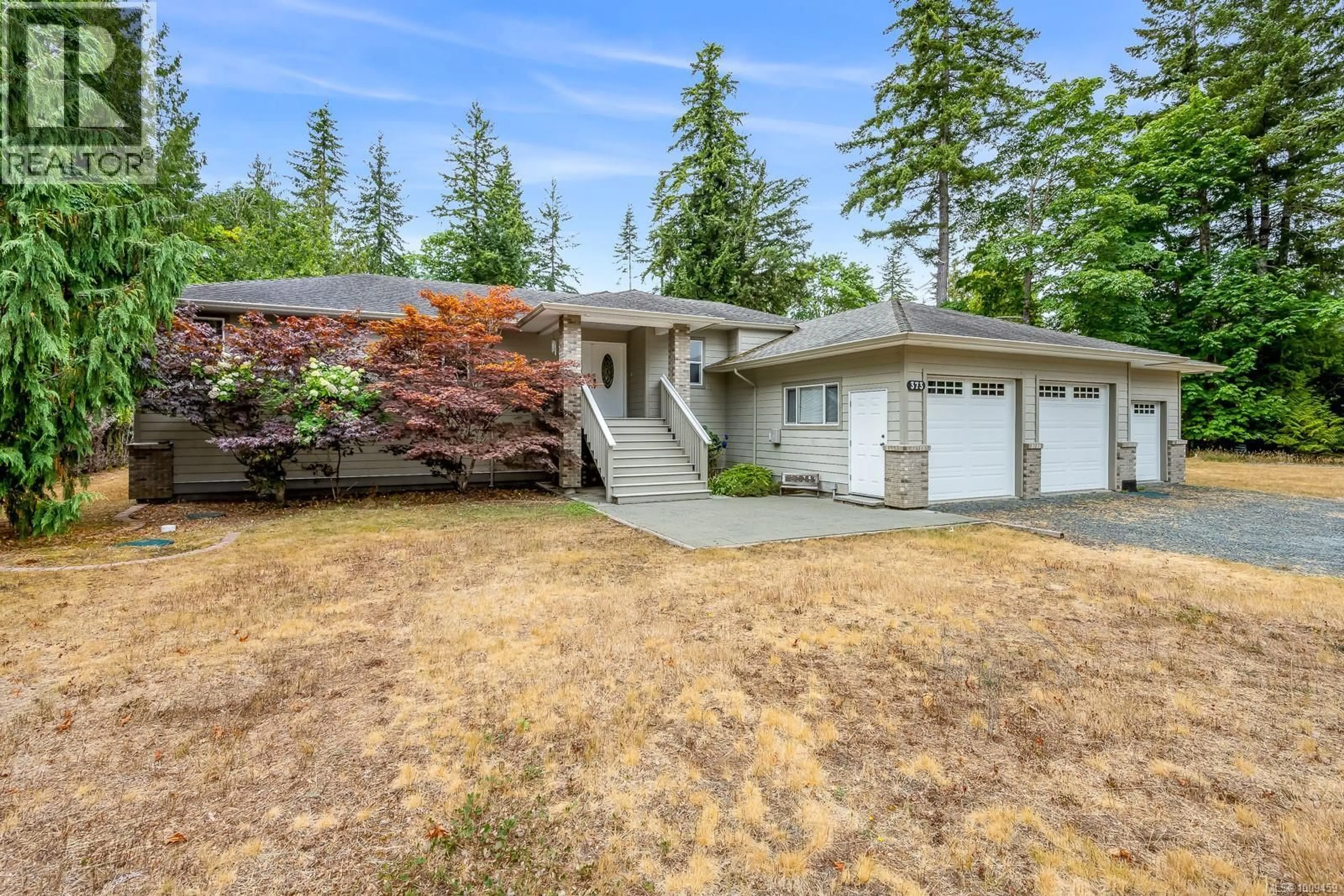 Home with vinyl exterior material, street for 373 BATES DRIVE, Fanny Bay British Columbia V0R1W0