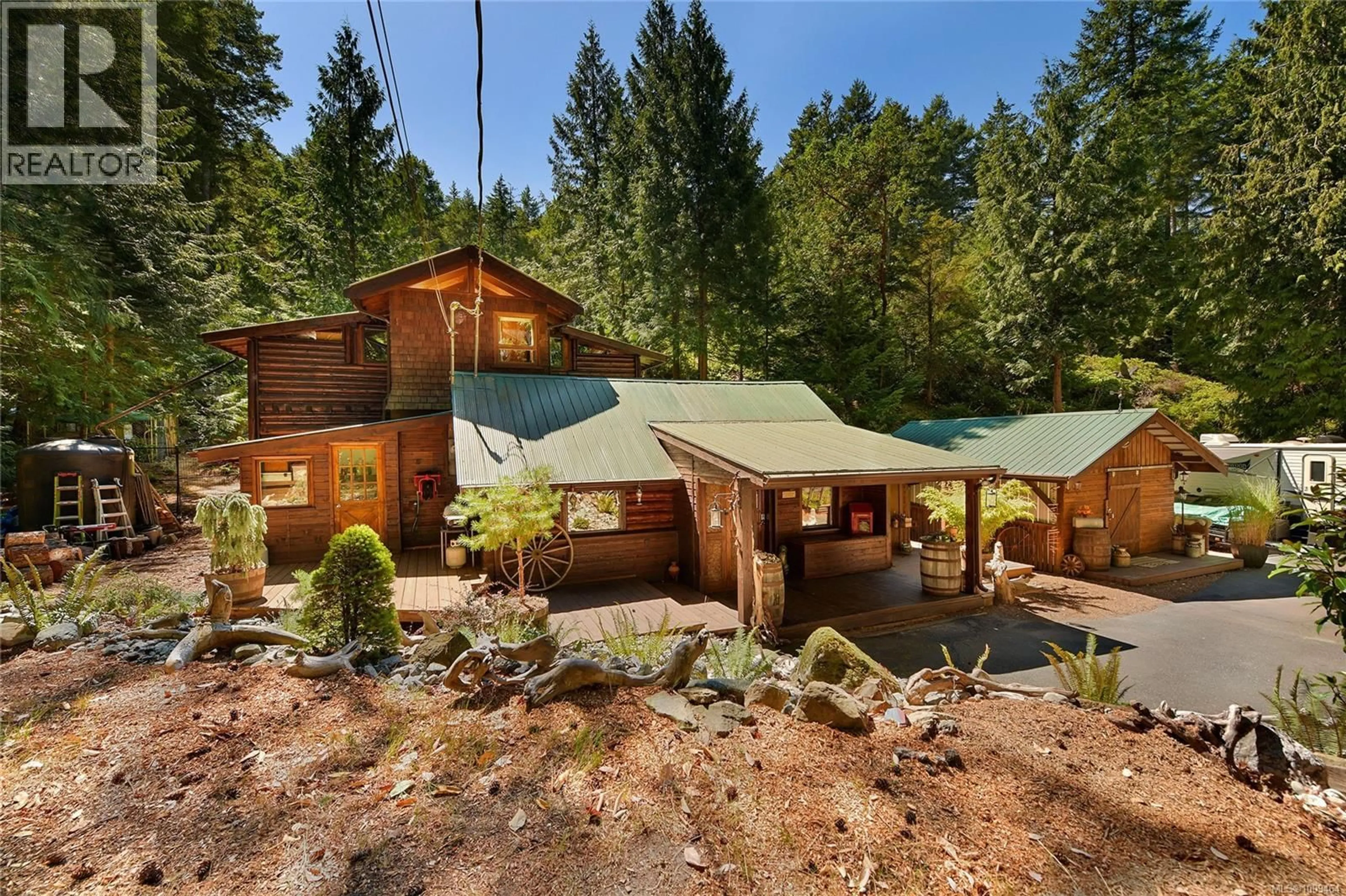 A pic from outside/outdoor area/front of a property/back of a property/a pic from drone, forest/trees view for 604 WAUGH ROAD, Mayne Island British Columbia V0N2J1