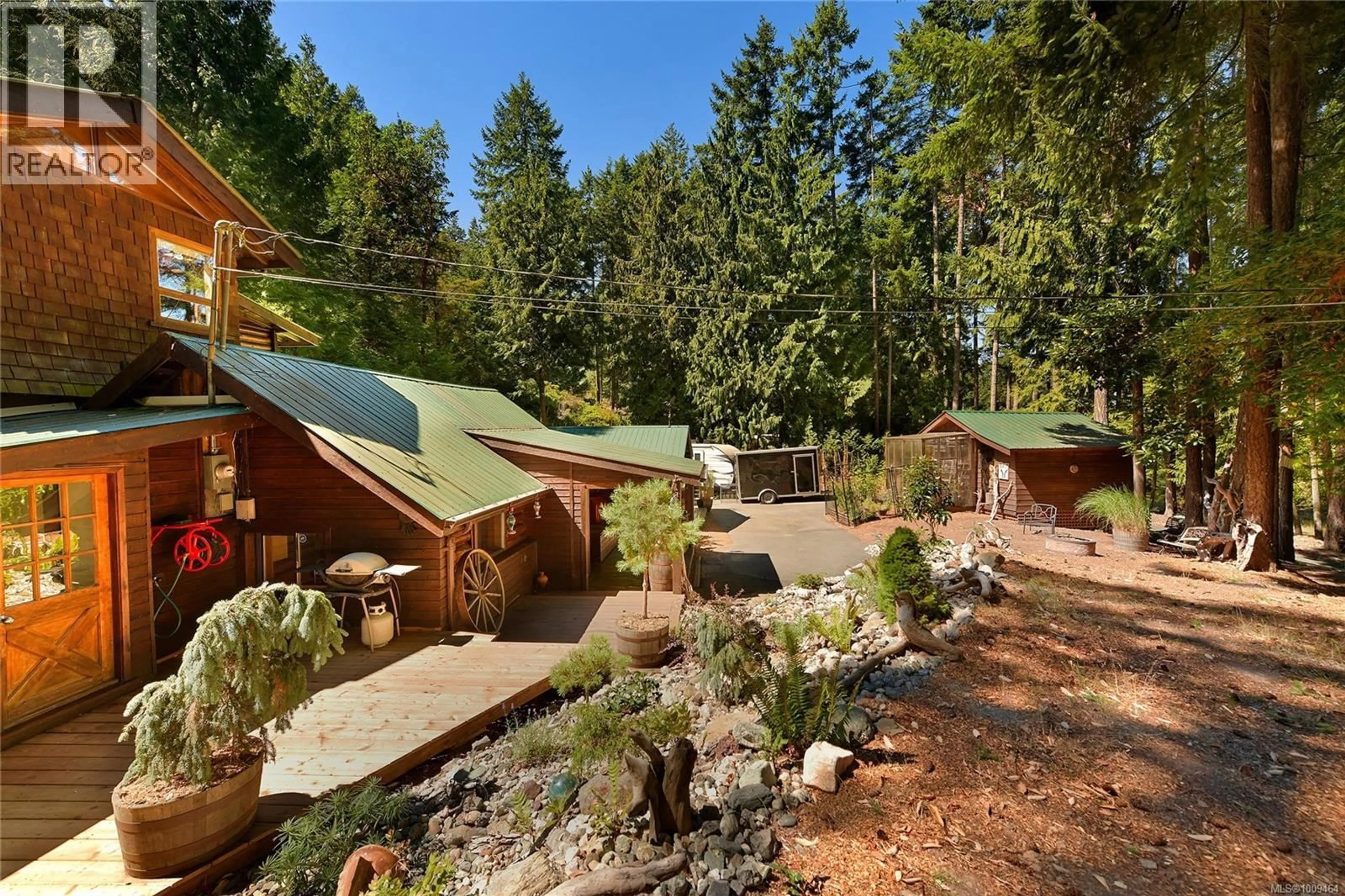 Patio, forest/trees view for 604 WAUGH ROAD, Mayne Island British Columbia V0N2J1