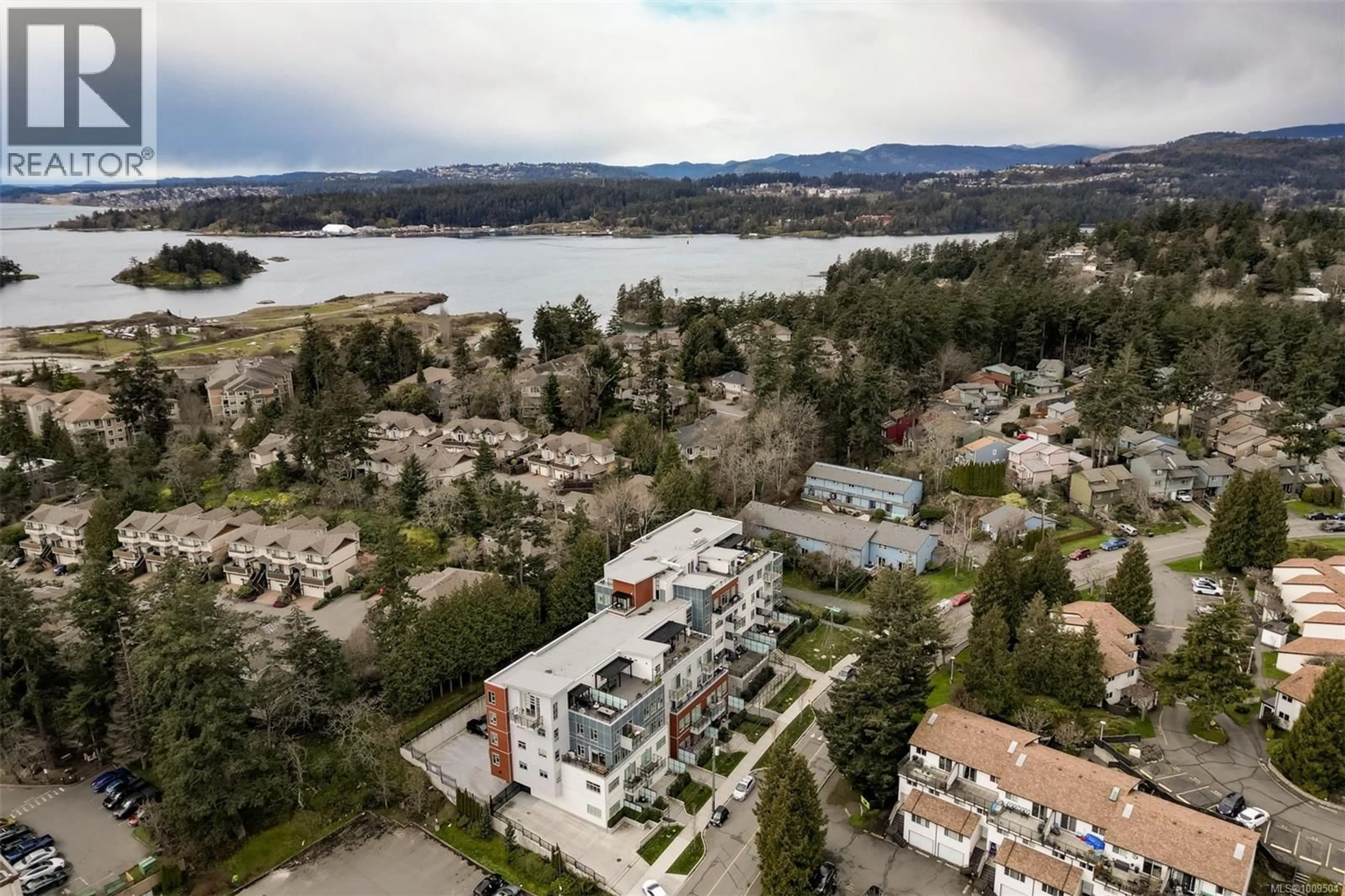 A pic from outside/outdoor area/front of a property/back of a property/a pic from drone, water/lake/river/ocean view for 413 - 1450 GLENTANA ROAD, View Royal British Columbia V9A4J9