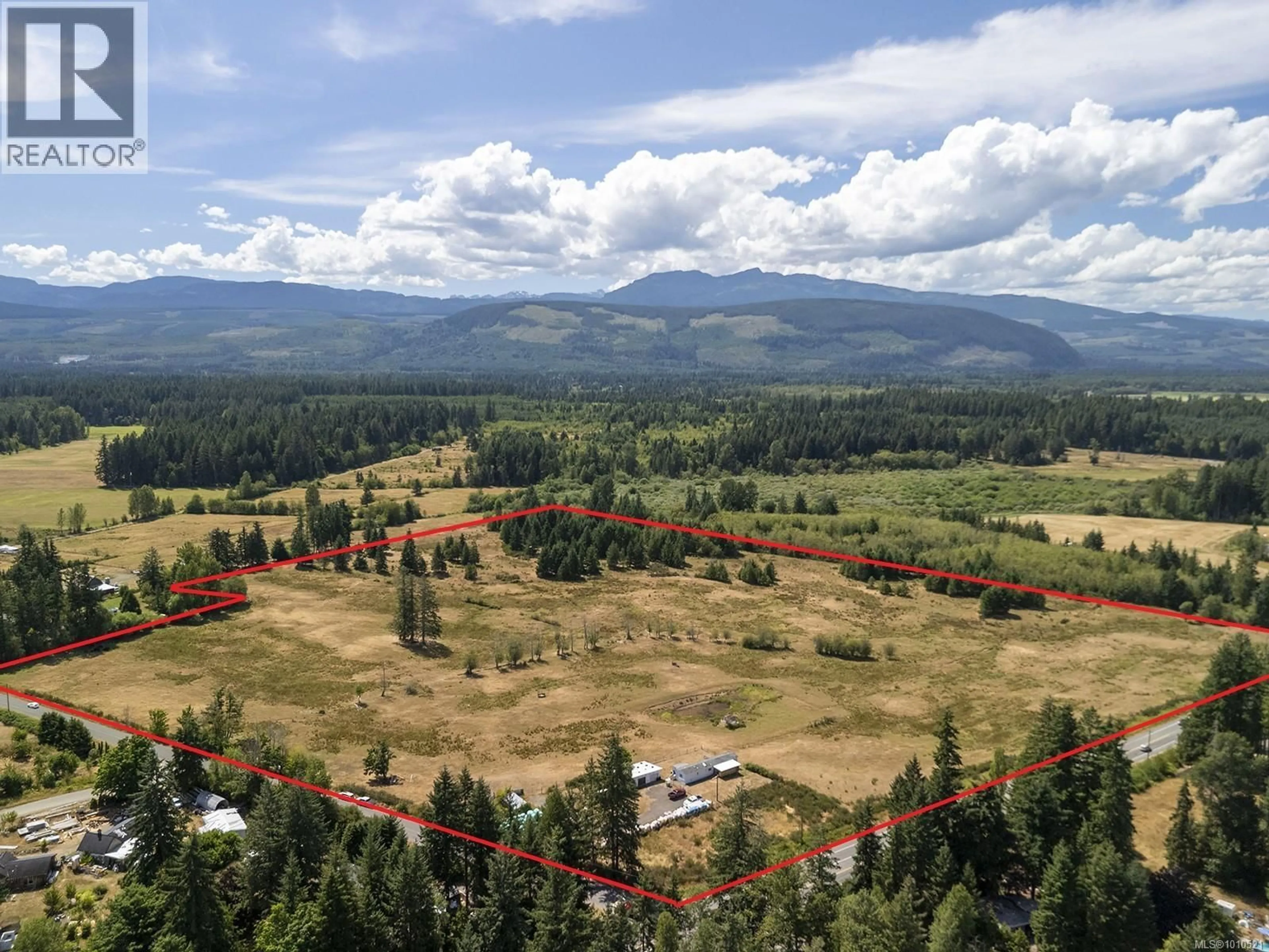 A pic from outside/outdoor area/front of a property/back of a property/a pic from drone, mountain view for 7561 HOWARD ROAD, Black Creek British Columbia V9J1G2