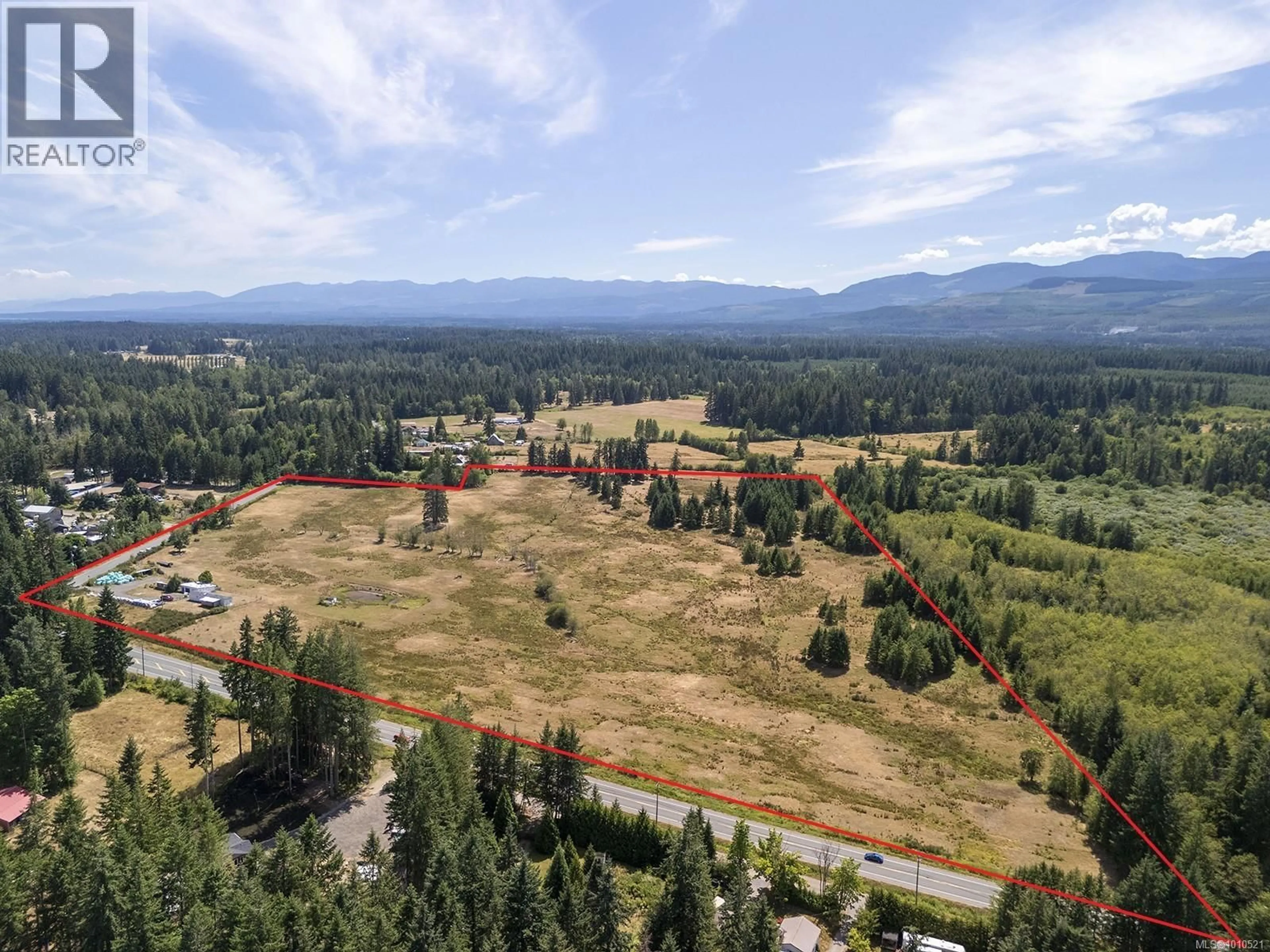 A pic from outside/outdoor area/front of a property/back of a property/a pic from drone, mountain view for 7561 HOWARD ROAD, Black Creek British Columbia V9J1G2