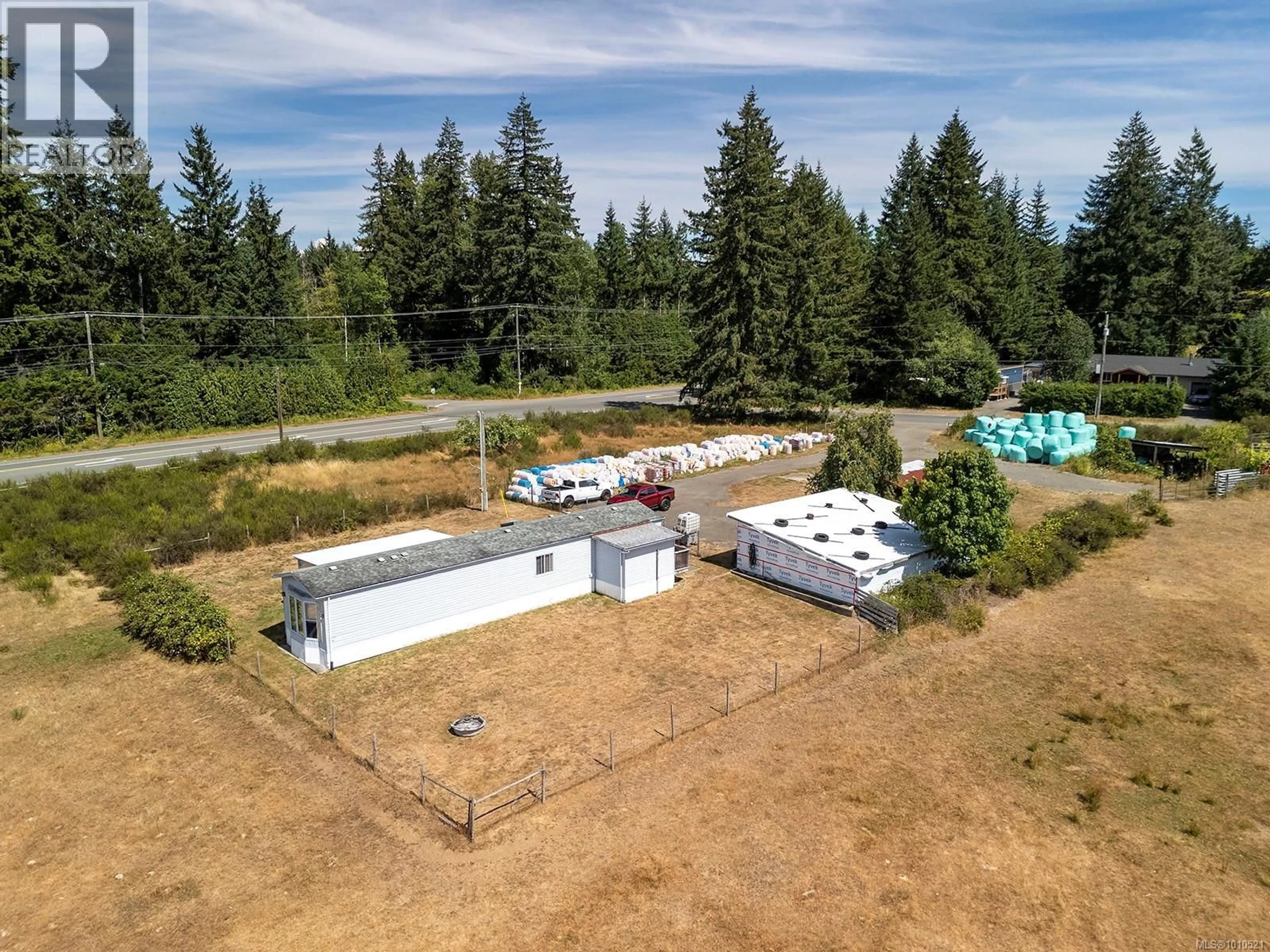 A pic from outside/outdoor area/front of a property/back of a property/a pic from drone, unknown for 7561 HOWARD ROAD, Black Creek British Columbia V9J1G2