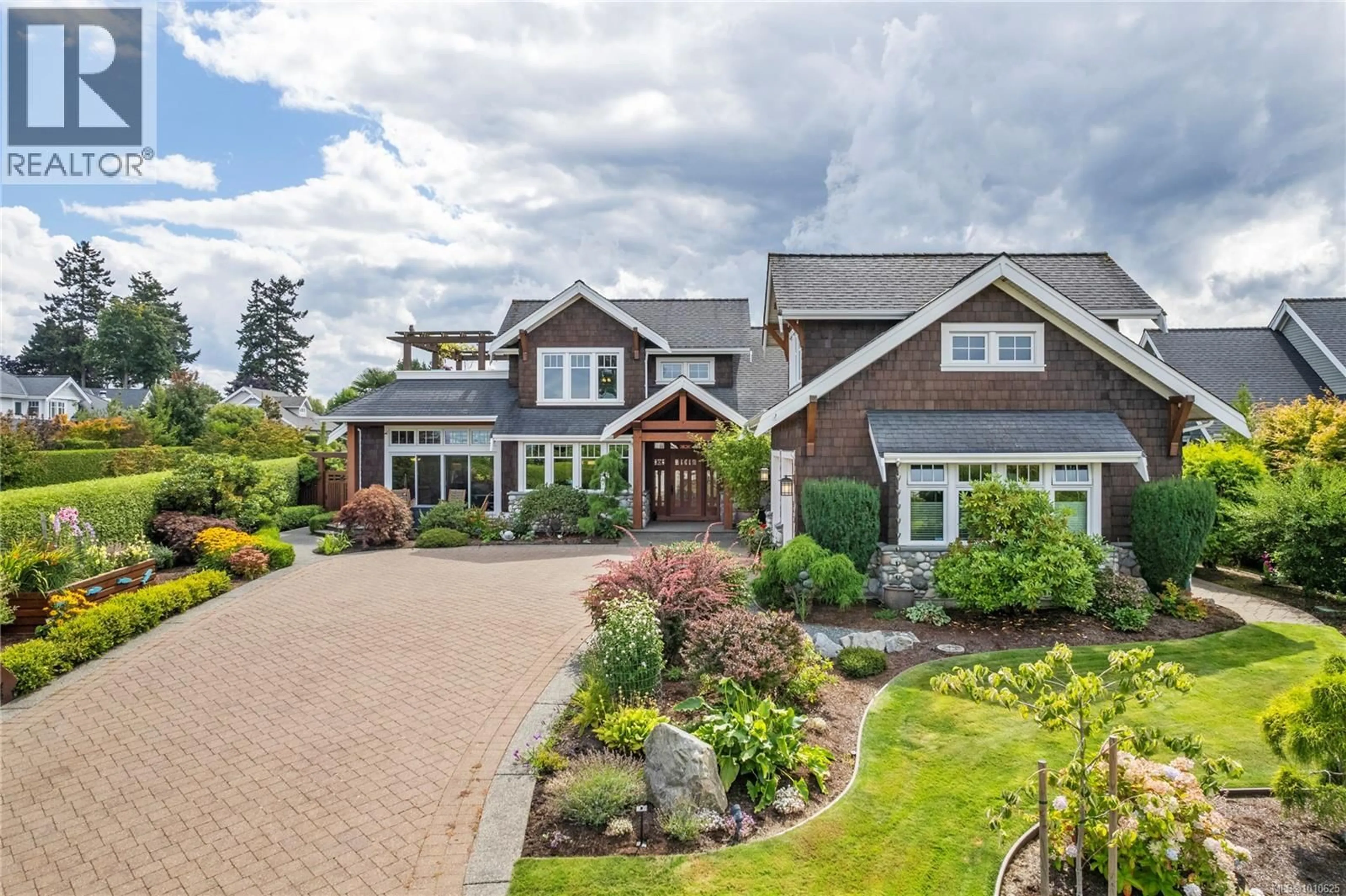 Home with brick exterior material, unknown for 942 BLUFFS DRIVE, Qualicum Beach British Columbia V9K0A2