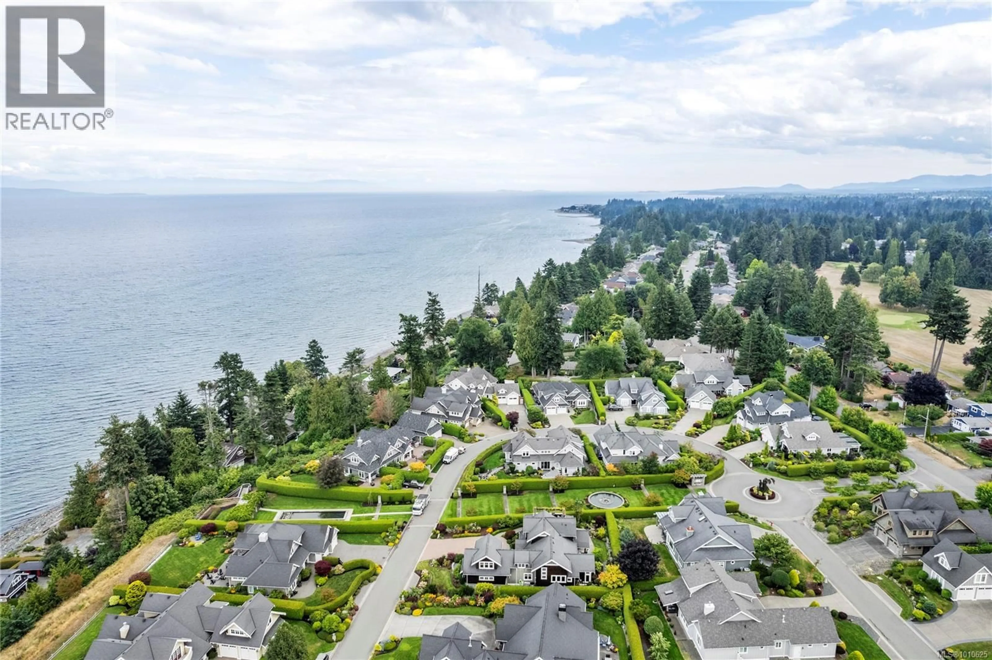 A pic from outside/outdoor area/front of a property/back of a property/a pic from drone, water/lake/river/ocean view for 942 BLUFFS DRIVE, Qualicum Beach British Columbia V9K0A2