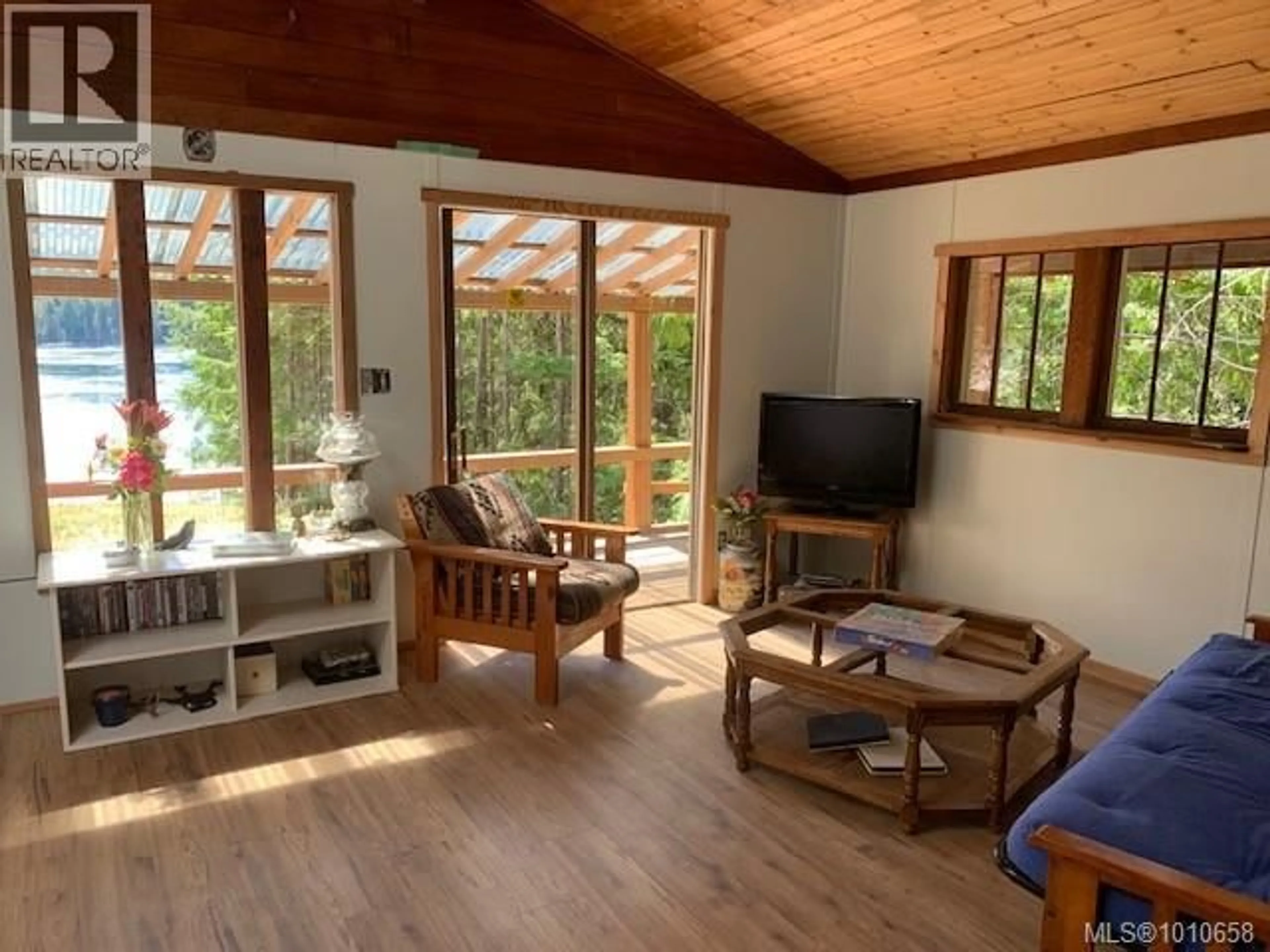 Living room with furniture, wood/laminate floor for Lot 49 BUSBY ISLAND, See Remarks British Columbia V0P1W0