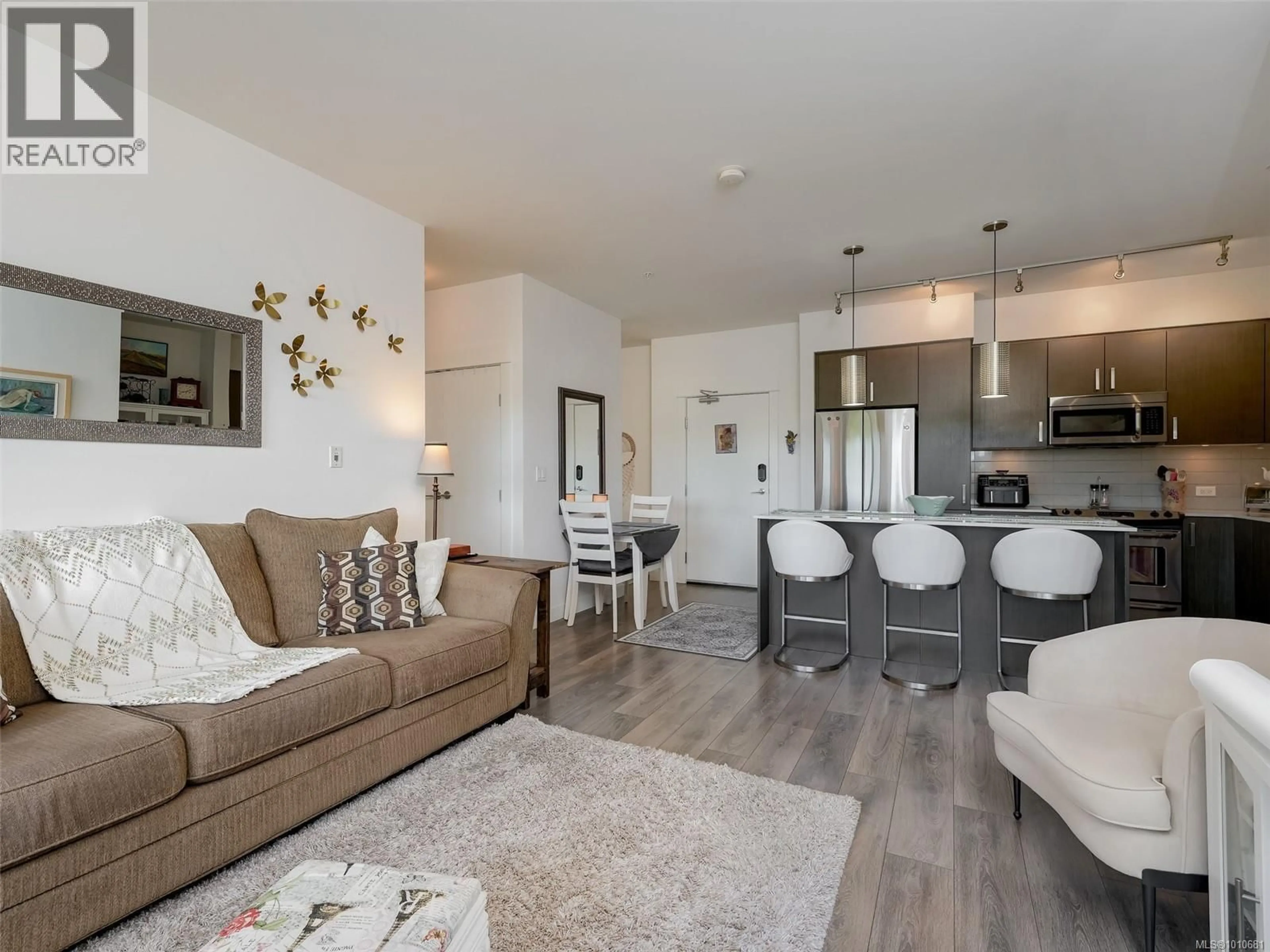 Living room with furniture, wood/laminate floor for 304 - 290 WILFERT ROAD, View Royal British Columbia V9C0H6