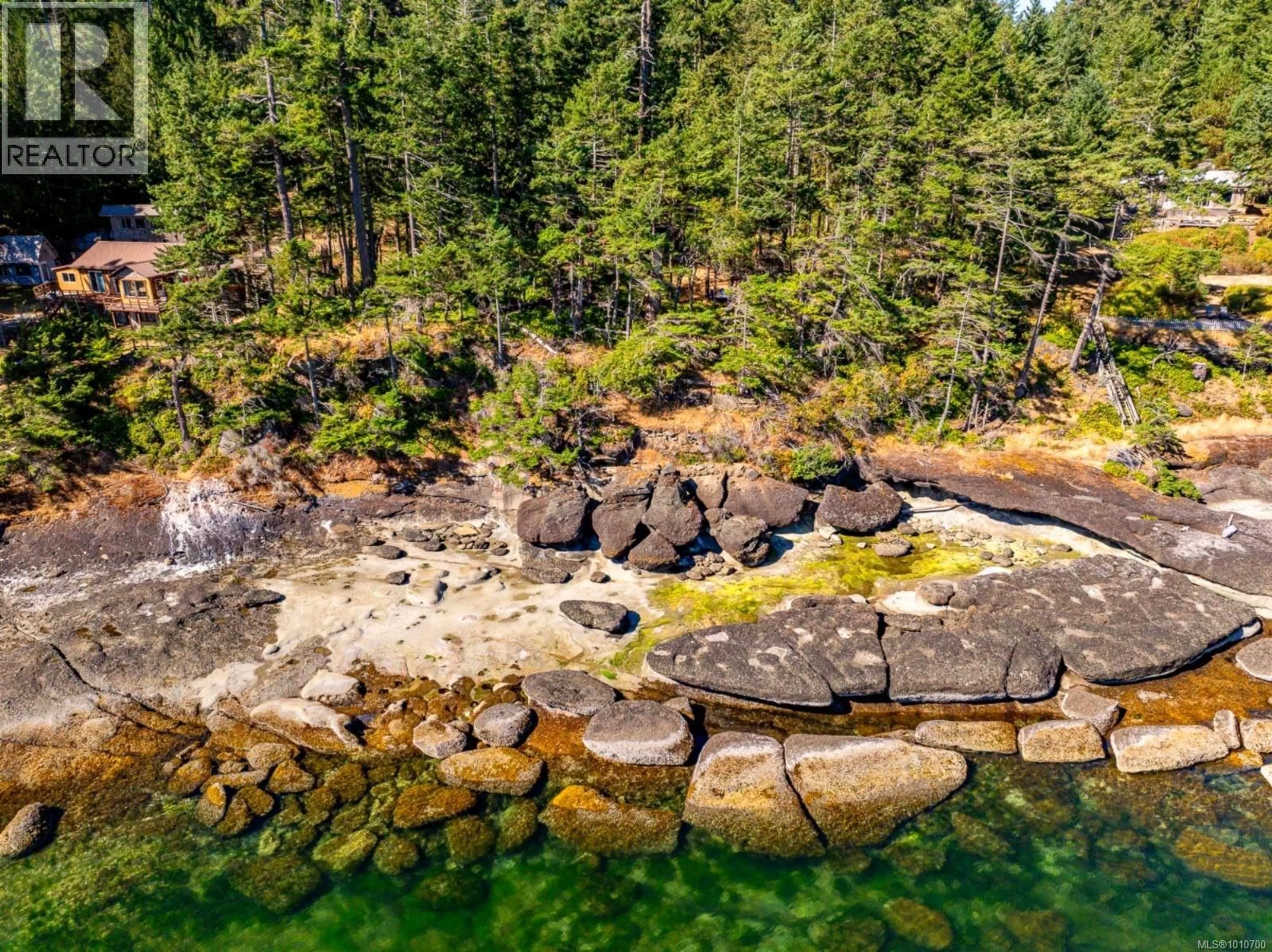 A pic from outside/outdoor area/front of a property/back of a property/a pic from drone, water/lake/river/ocean view for 6552 EAST ROAD, Denman Island British Columbia V0R1T0
