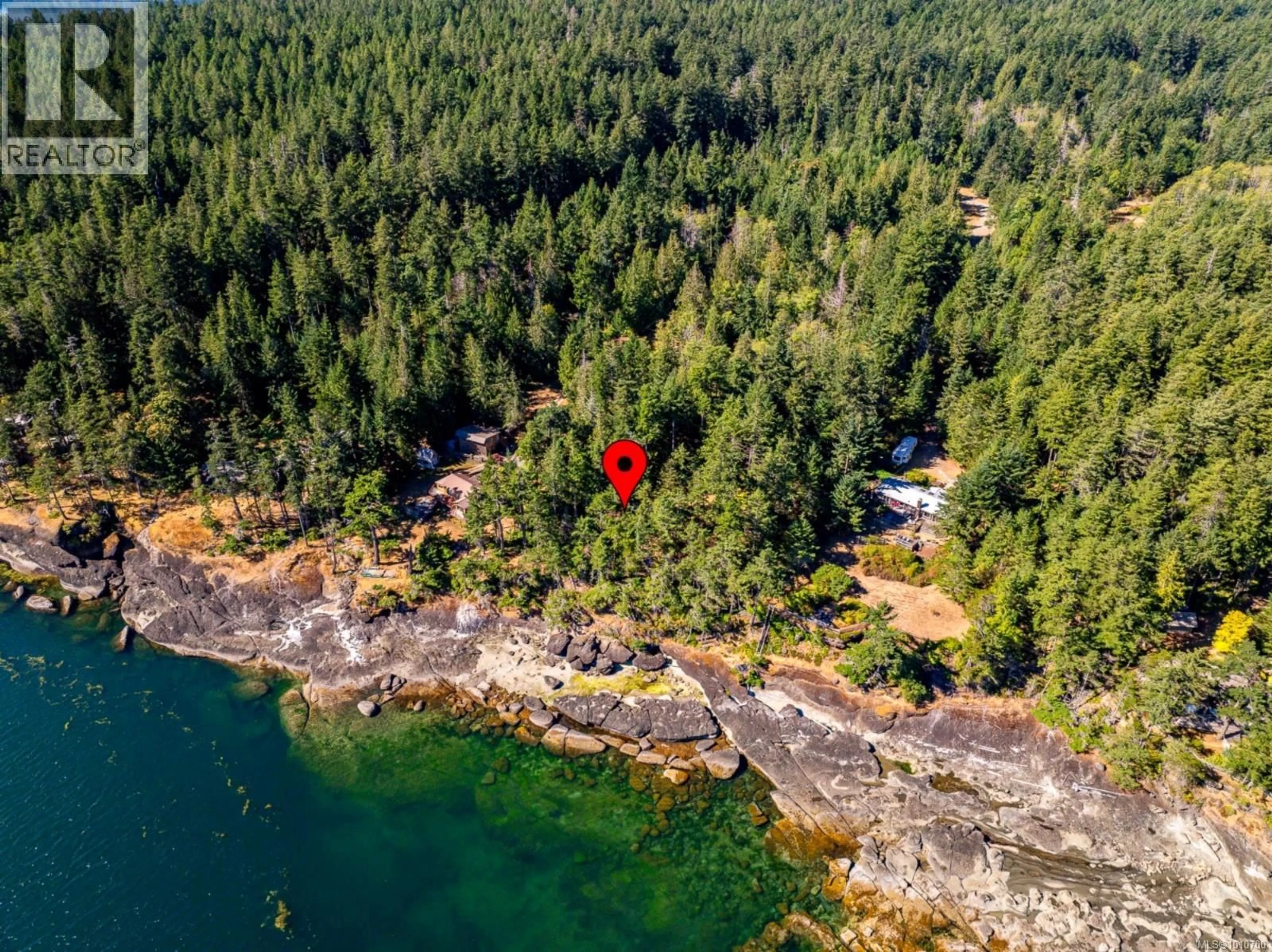 A pic from outside/outdoor area/front of a property/back of a property/a pic from drone, water/lake/river/ocean view for 6552 EAST ROAD, Denman Island British Columbia V0R1T0