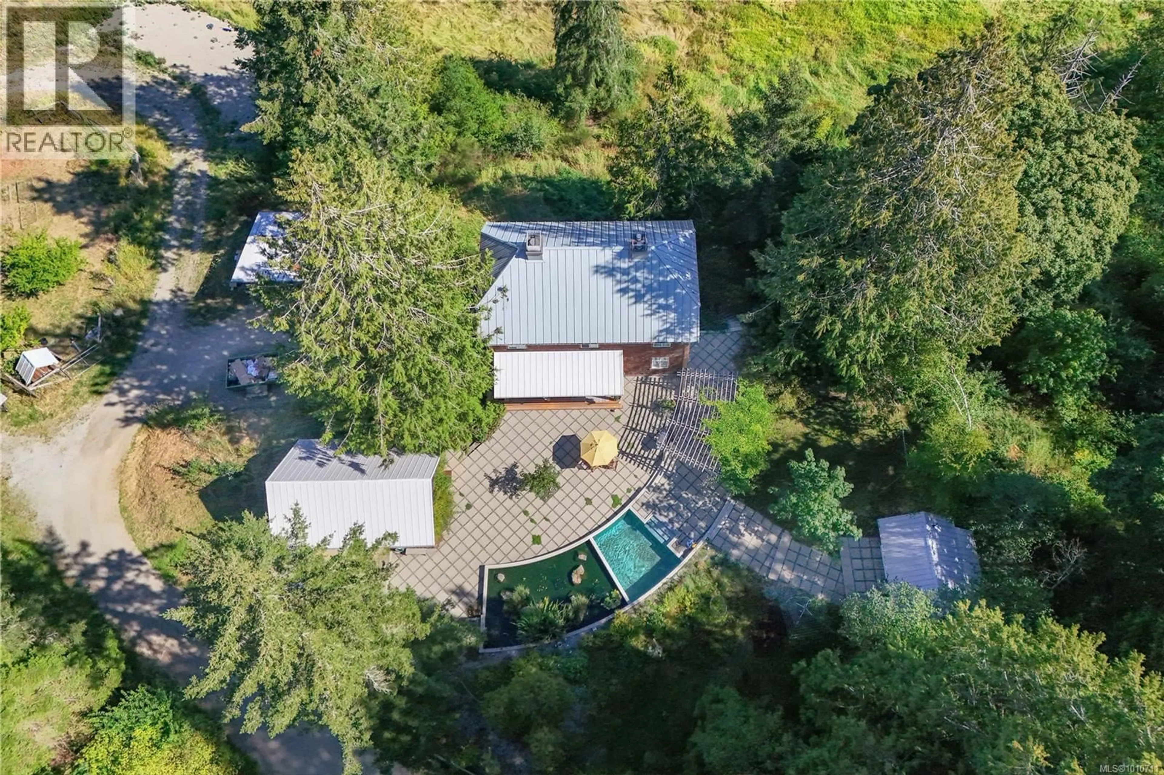 A pic from outside/outdoor area/front of a property/back of a property/a pic from drone, forest/trees view for 121 PEREGRINE WAY, Salt Spring British Columbia V8K2M1