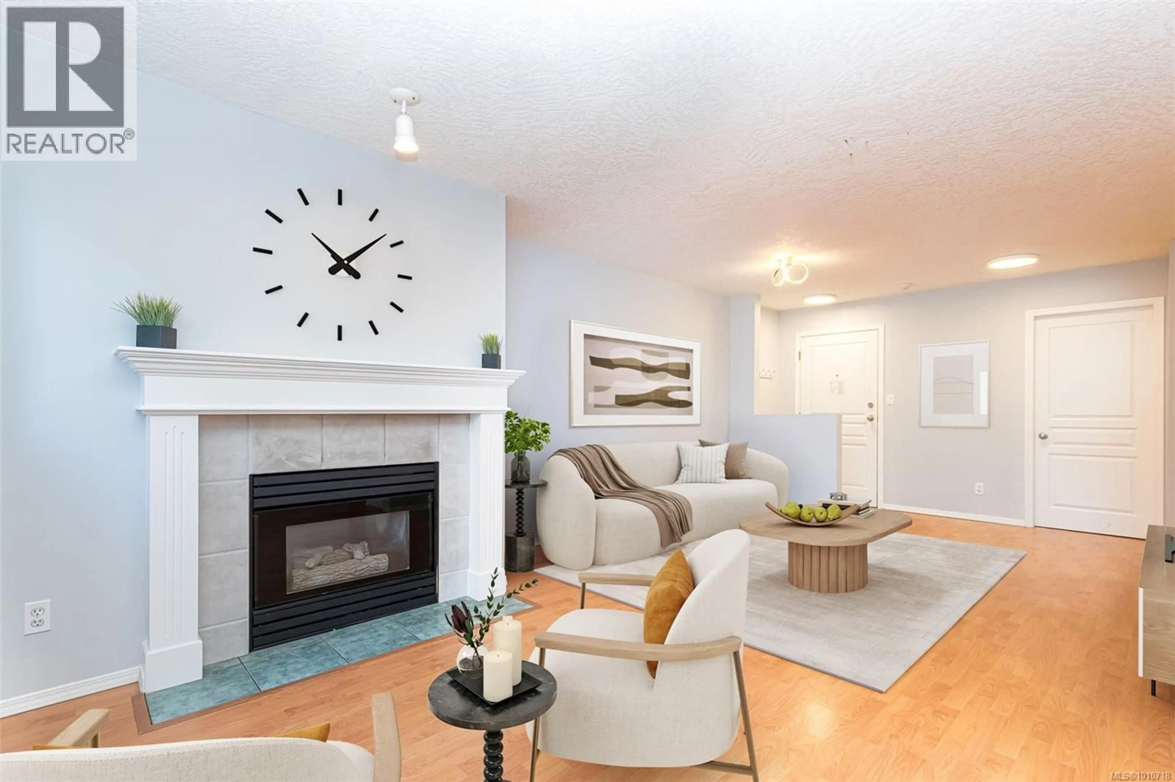 Living room with furniture, wood/laminate floor for 110 - 894 VERNON AVENUE, Saanich British Columbia V8X2W6