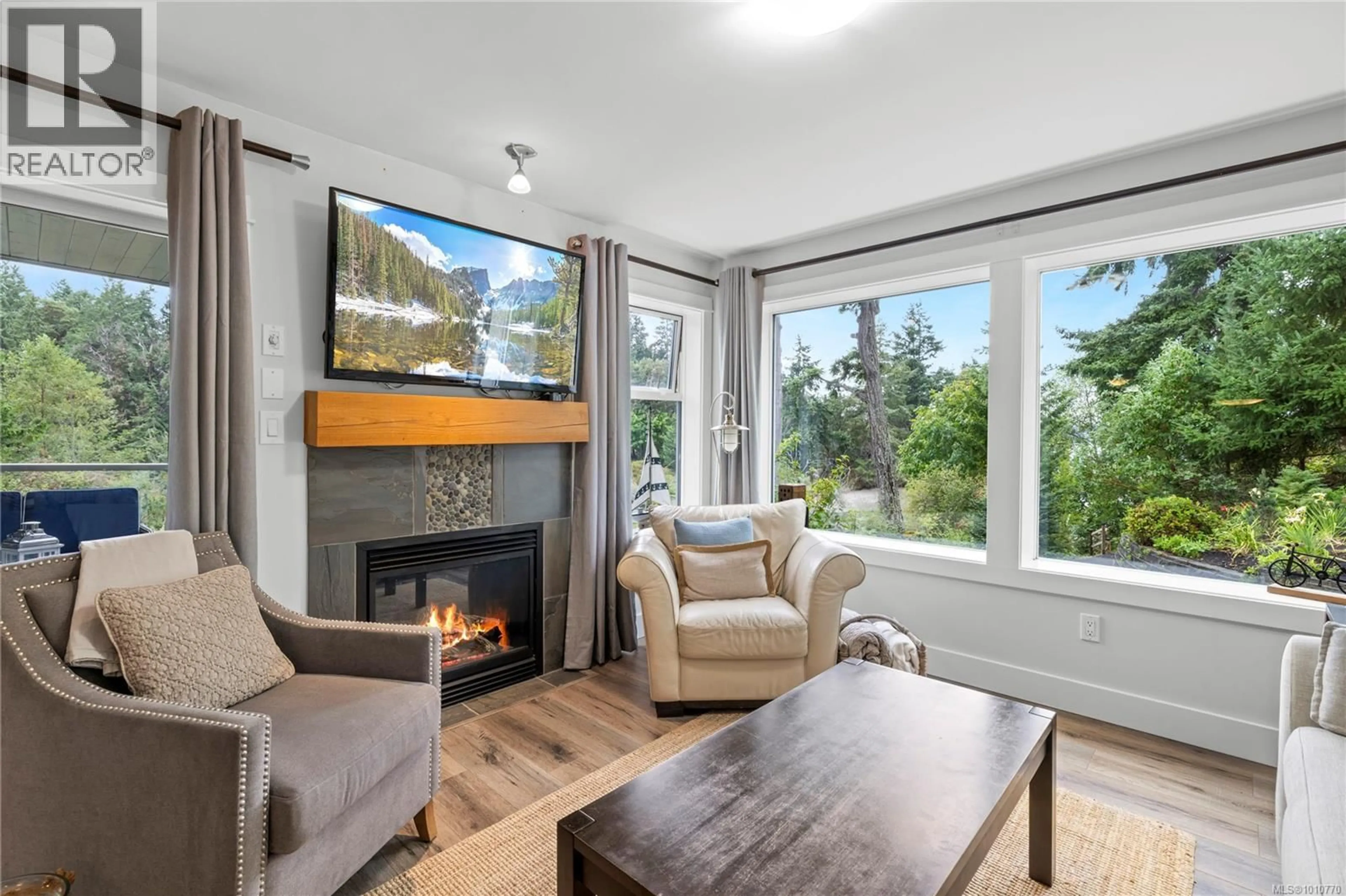 Living room with furniture, wood/laminate floor for 227 - 1600 STROULGER ROAD, Nanoose Bay British Columbia V9P9B7
