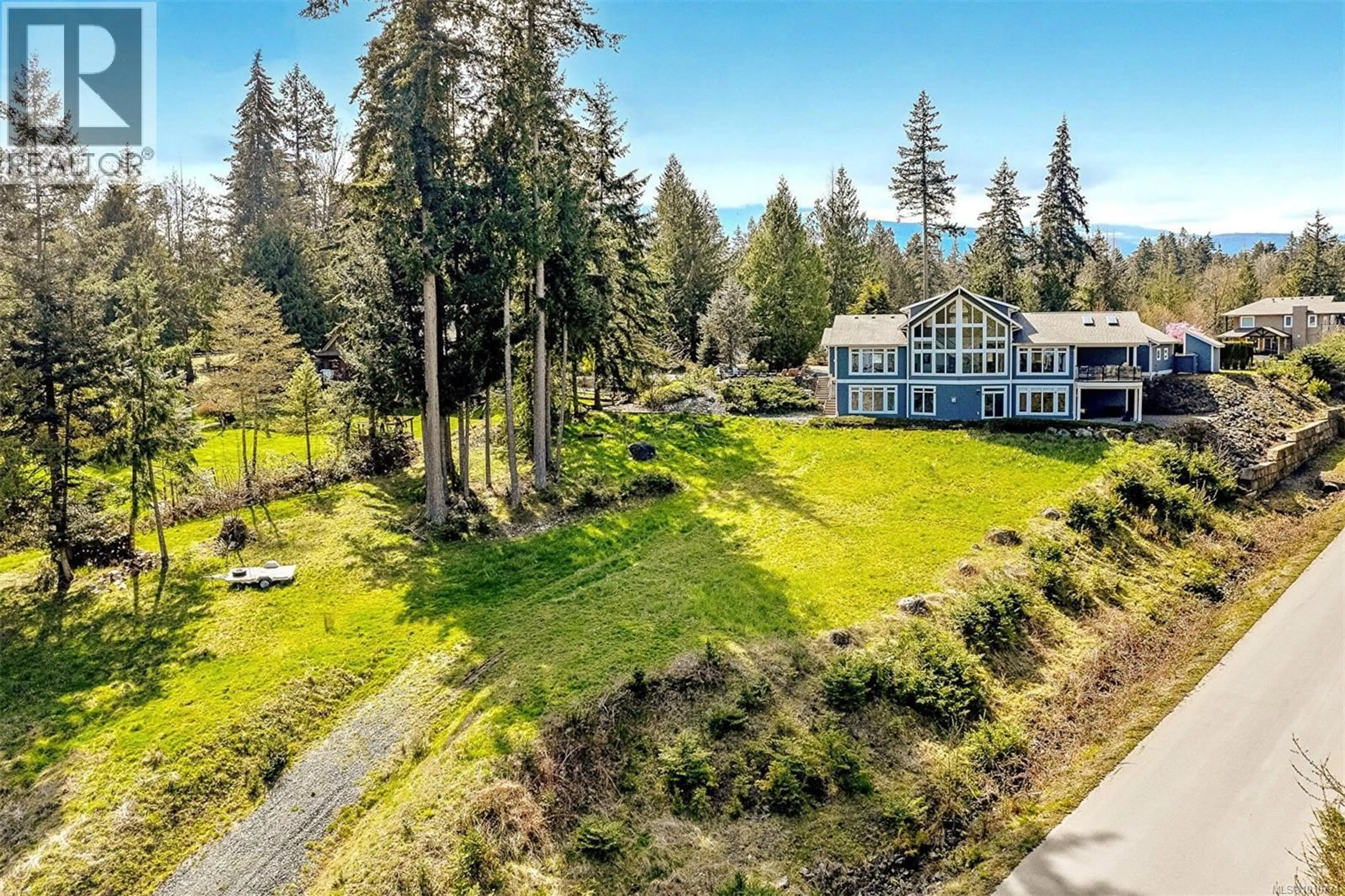 A pic from outside/outdoor area/front of a property/back of a property/a pic from drone, unknown for 10801 GUILBRIDE DRIVE, Saltair British Columbia V9G2B3