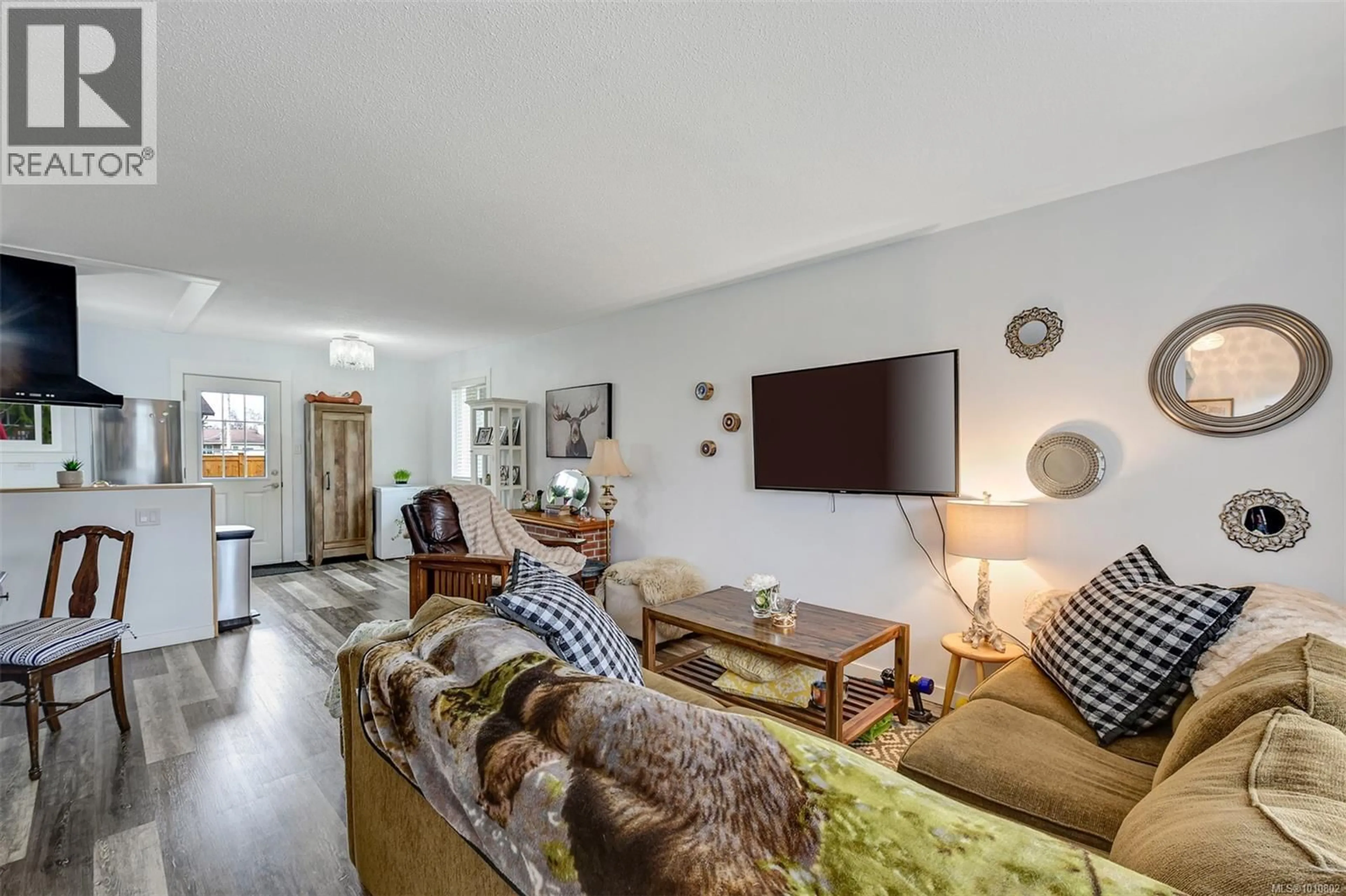 Living room with furniture, unknown for 2031/2033 MELVILLE DRIVE, Sidney British Columbia V8L2N2