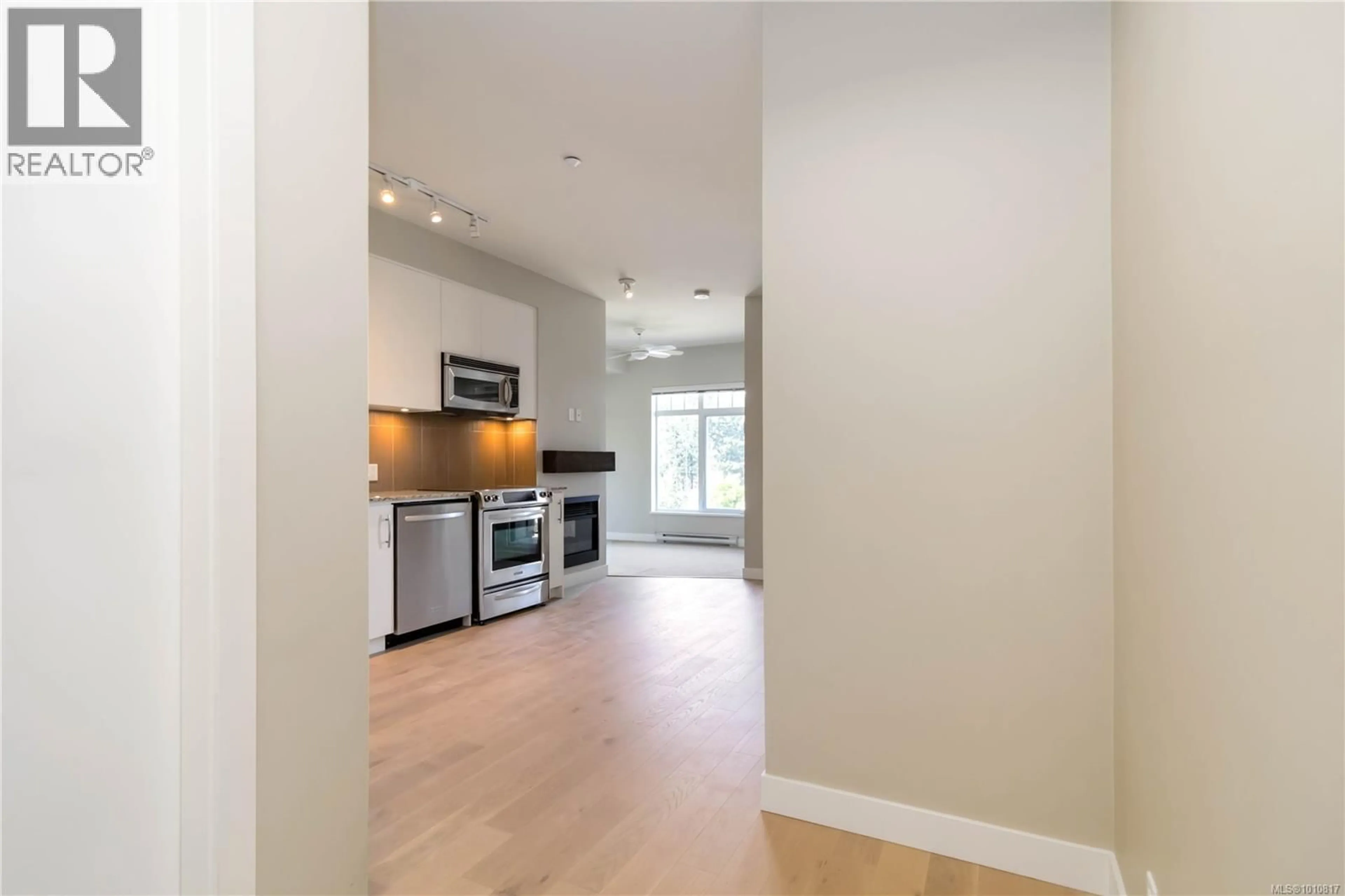 Open concept kitchen, wood/laminate floor for 319 - 1375 BEAR MOUNTAIN PARKWAY, Langford British Columbia V9B0C9