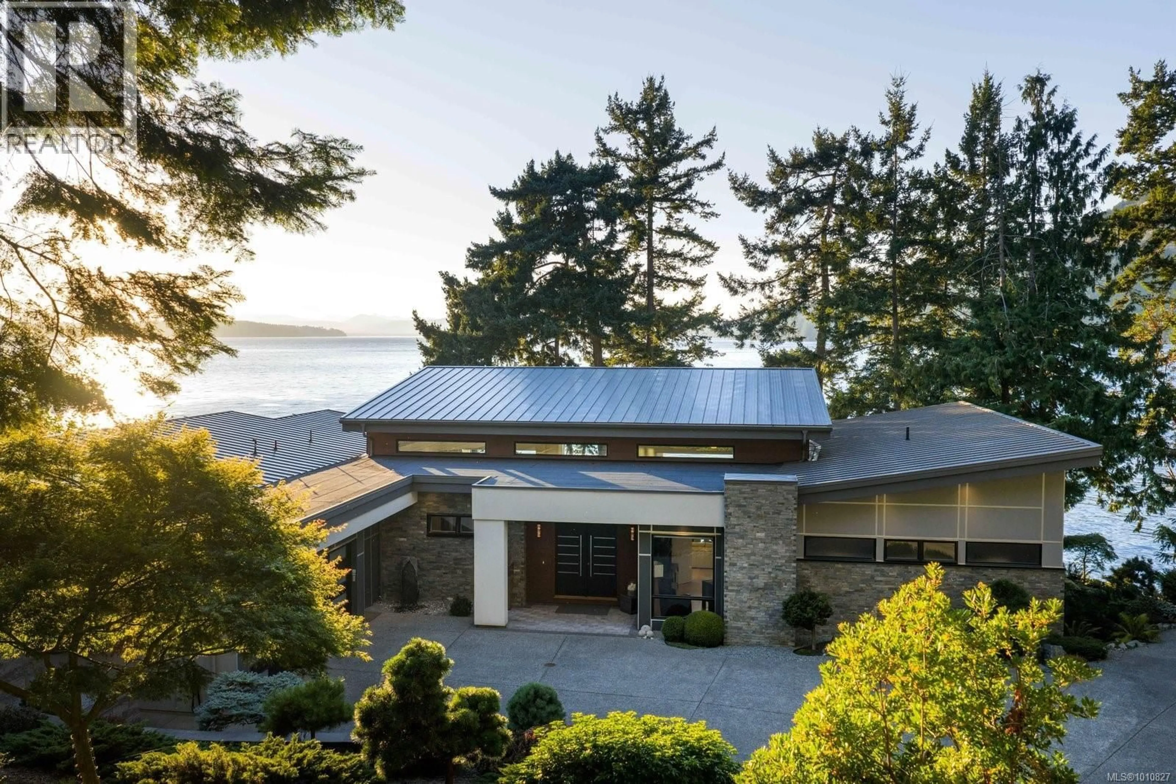 A pic from outside/outdoor area/front of a property/back of a property/a pic from drone, water/lake/river/ocean view for 568 LANDS END ROAD, North Saanich British Columbia V8L5K9