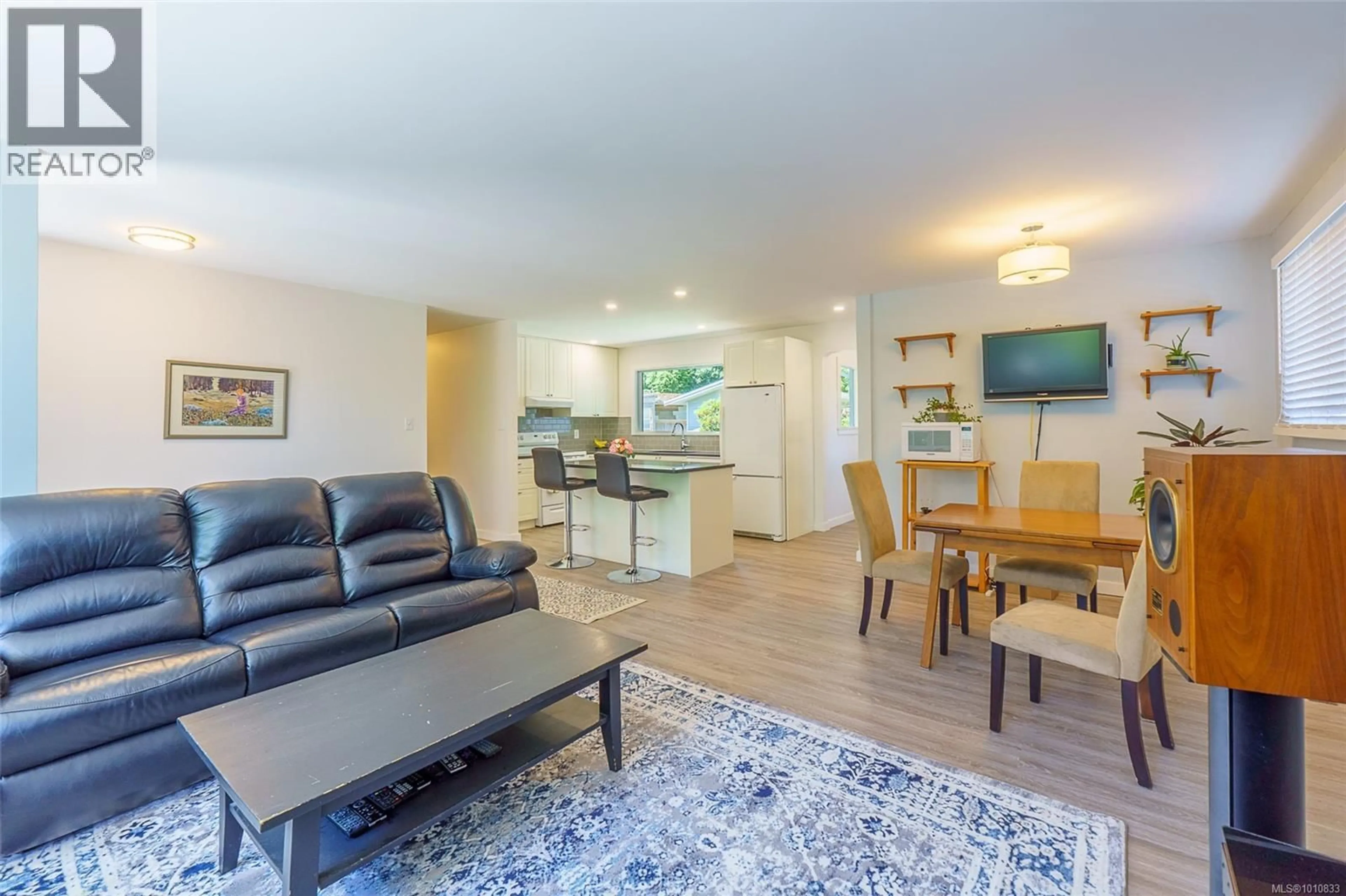 Living room with furniture, wood/laminate floor for 255 OTTER STREET, Ucluelet British Columbia V0R3A0