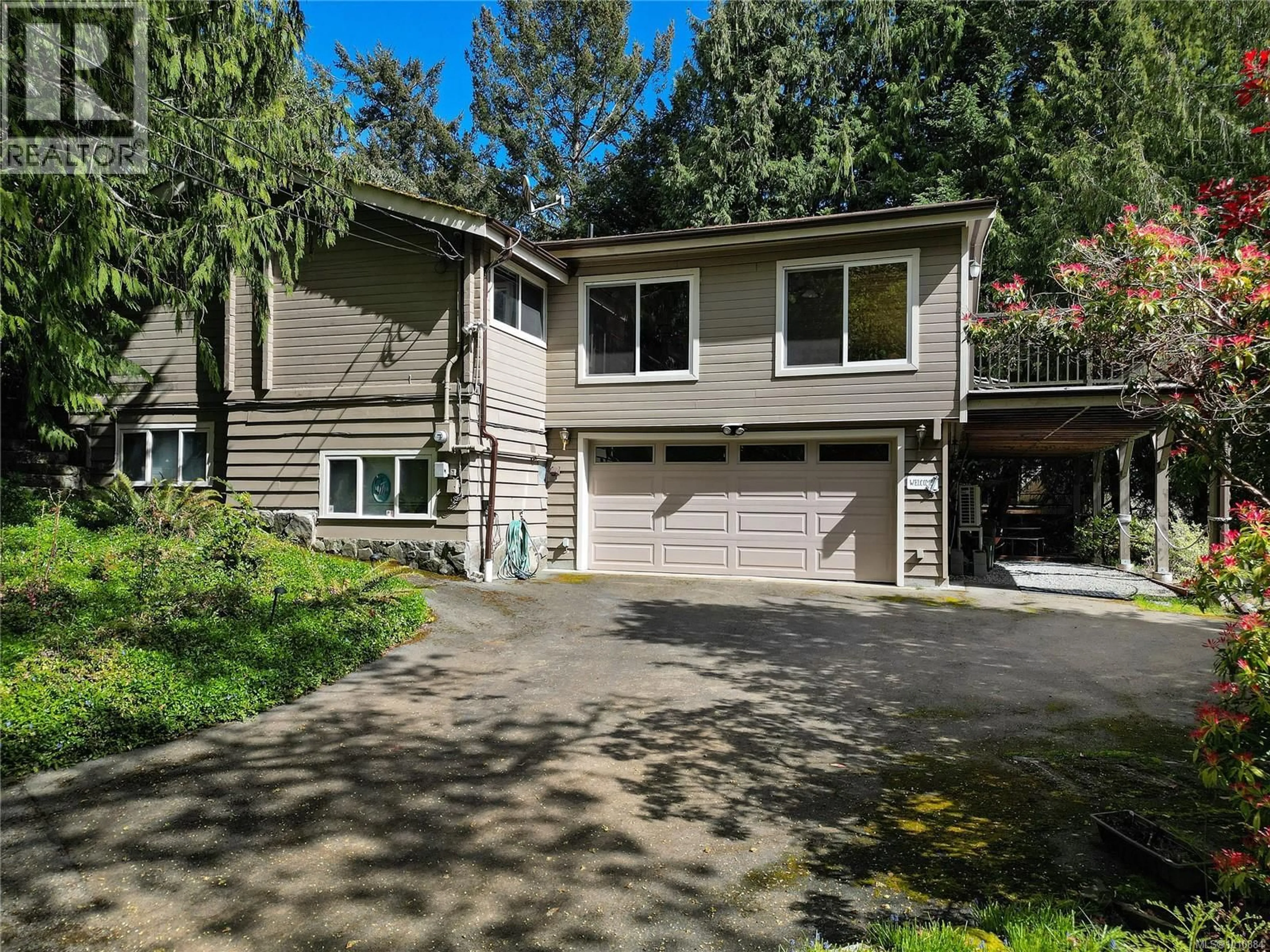 Home with vinyl exterior material, street for 10929 INWOOD ROAD, North Saanich British Columbia V8L5H9