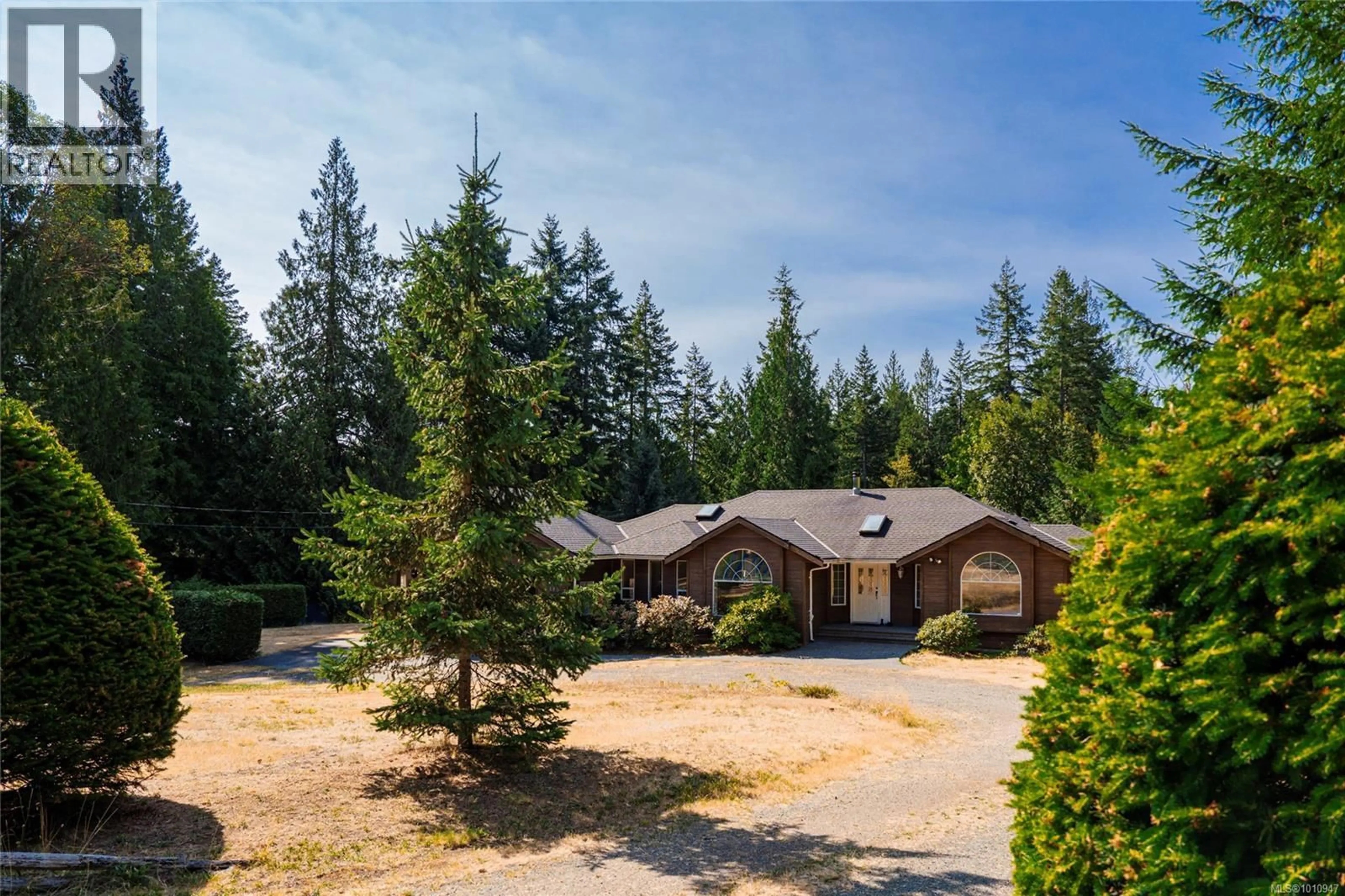 A pic from outside/outdoor area/front of a property/back of a property/a pic from drone, forest/trees view for 7185 ROYAL DRIVE, Lantzville British Columbia