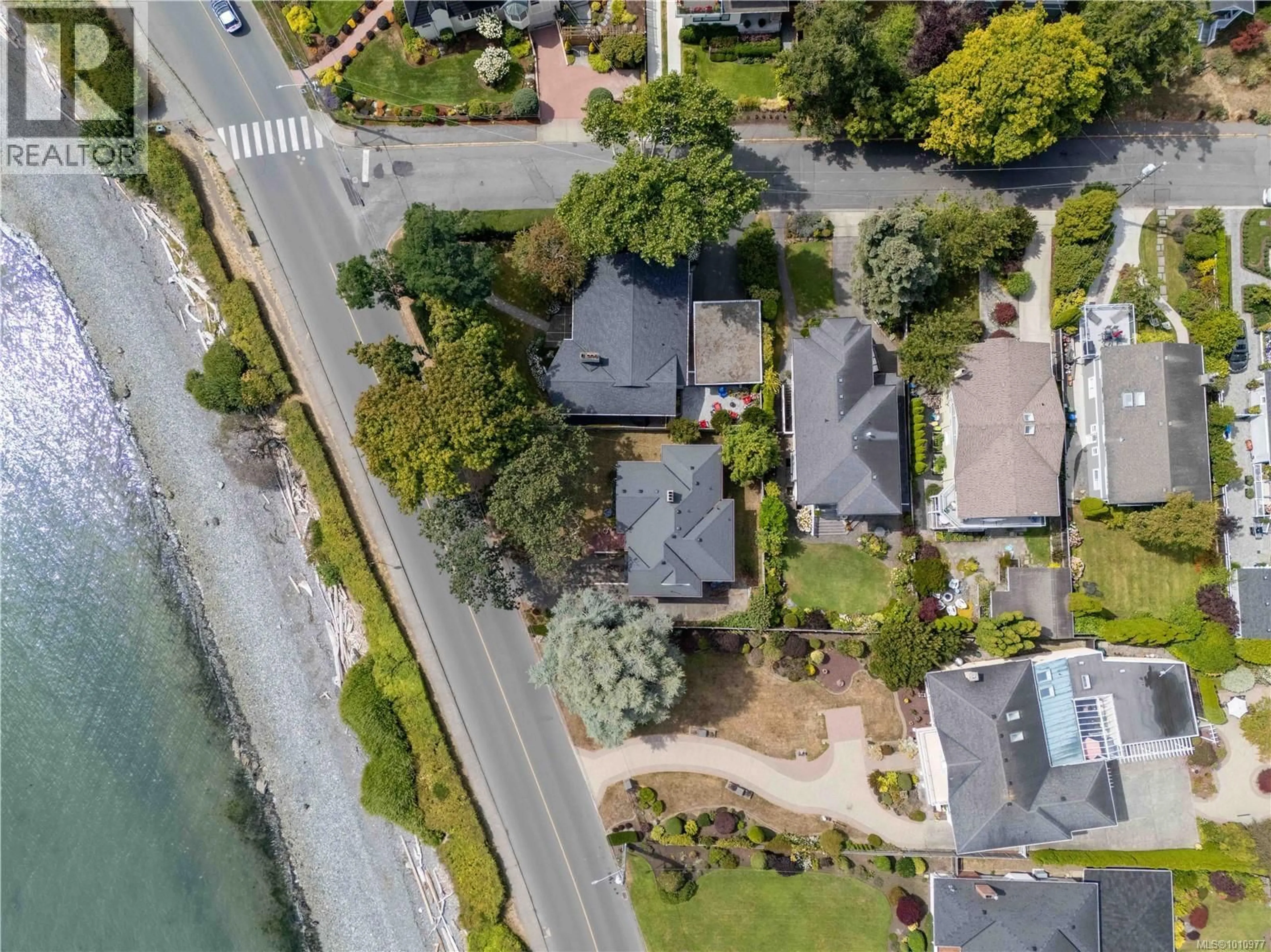 A pic from outside/outdoor area/front of a property/back of a property/a pic from drone, water/lake/river/ocean view for 320 BEACH DRIVE, Oak Bay British Columbia V8S2M2