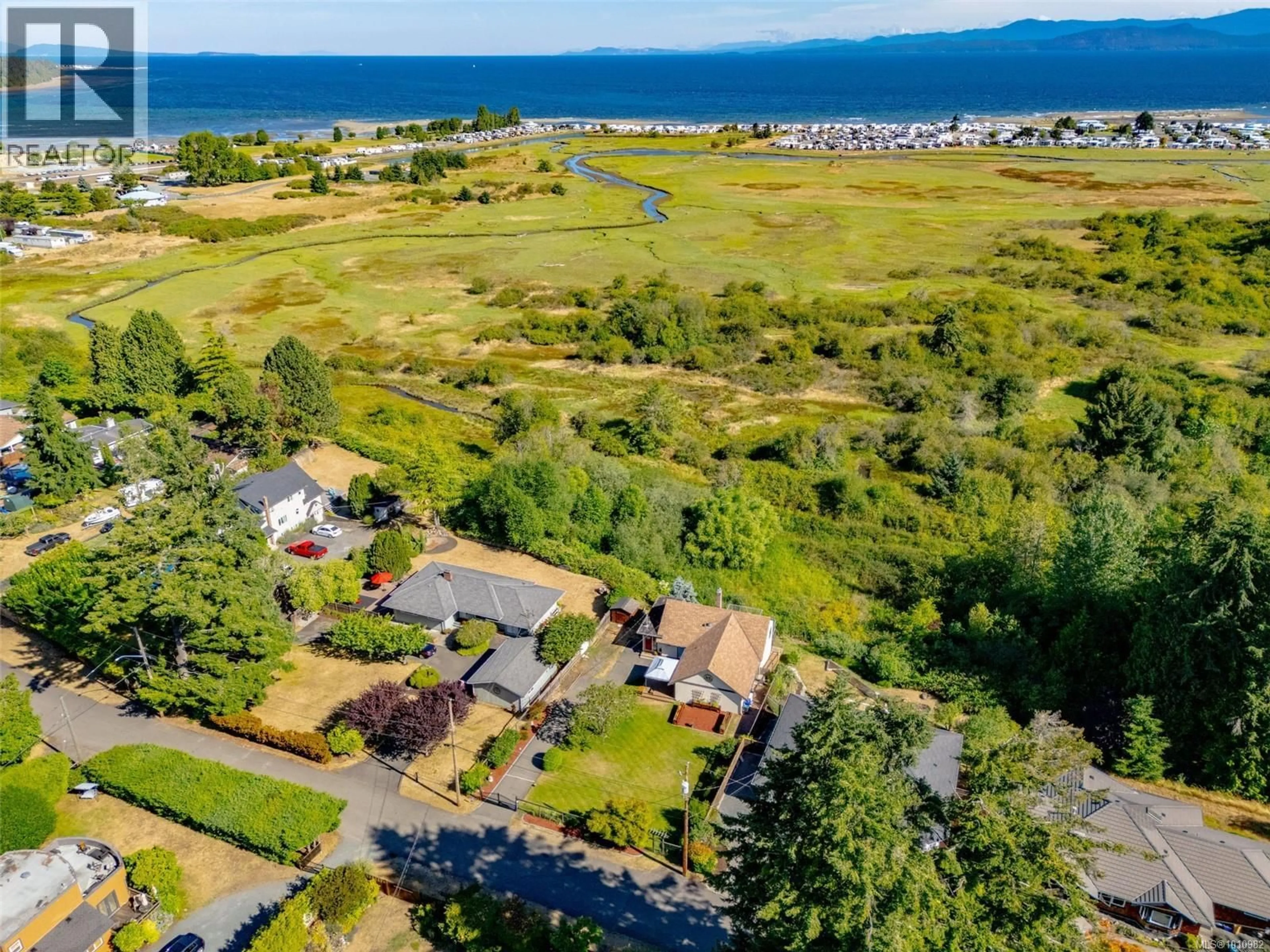 A pic from outside/outdoor area/front of a property/back of a property/a pic from drone, water/lake/river/ocean view for 405 HEATH AVENUE, Parksville British Columbia V9P1V3