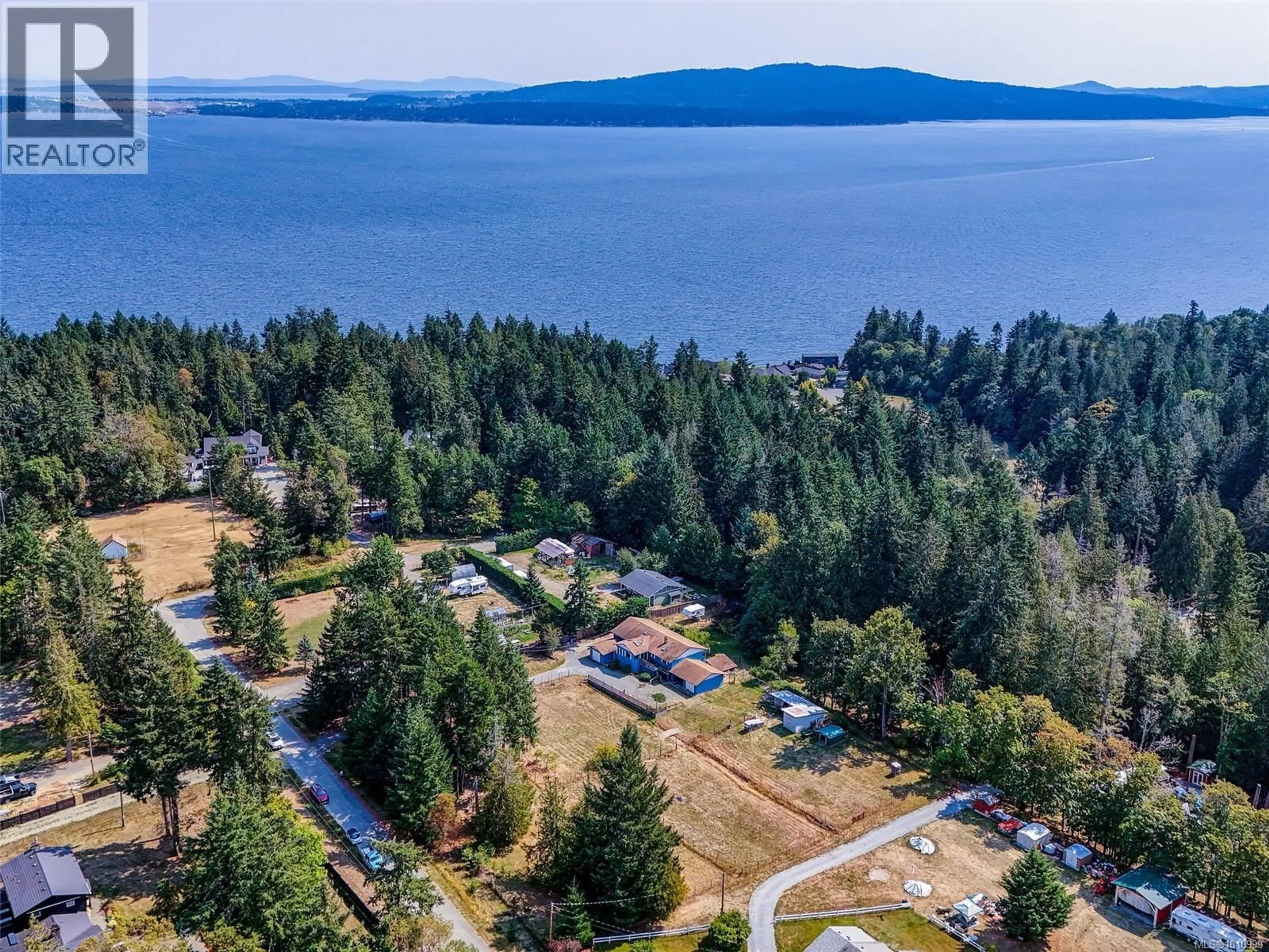 A pic from outside/outdoor area/front of a property/back of a property/a pic from drone, water/lake/river/ocean view for 510 VOUTRAIT ROAD, Mill Bay British Columbia V0R2P3