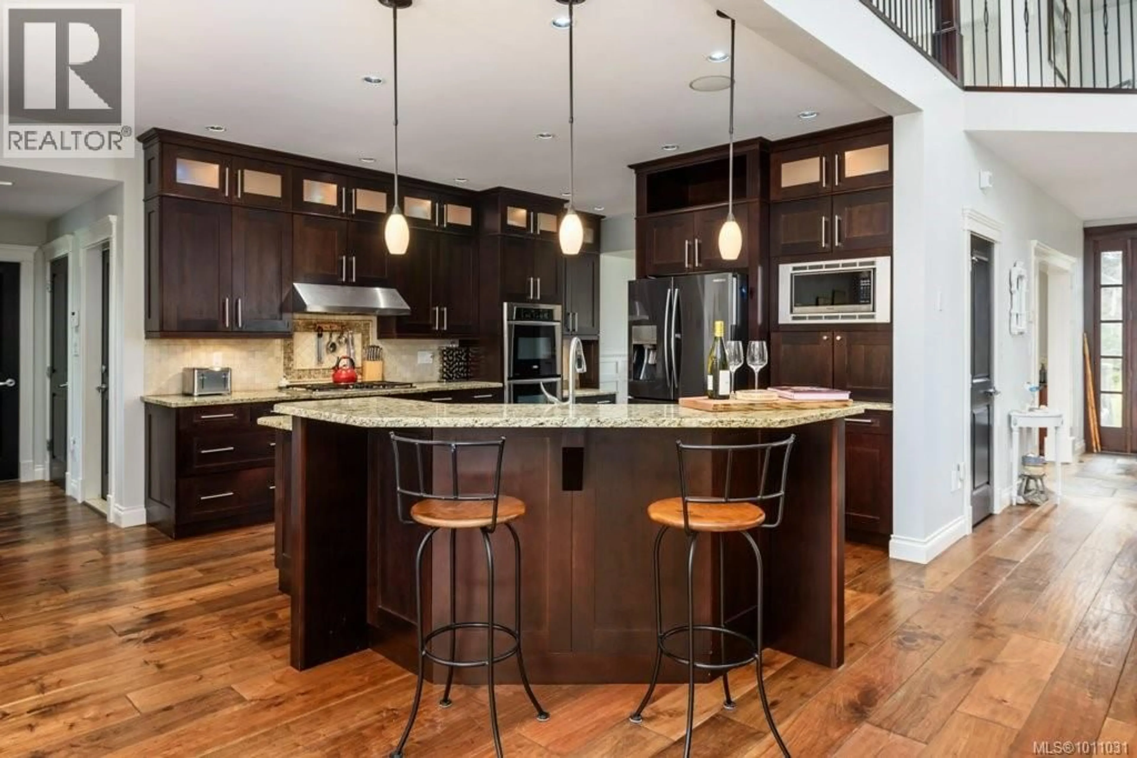 Open concept kitchen, wood/laminate floor for 1056 KINCORA LANE, Comox British Columbia V9M4C5