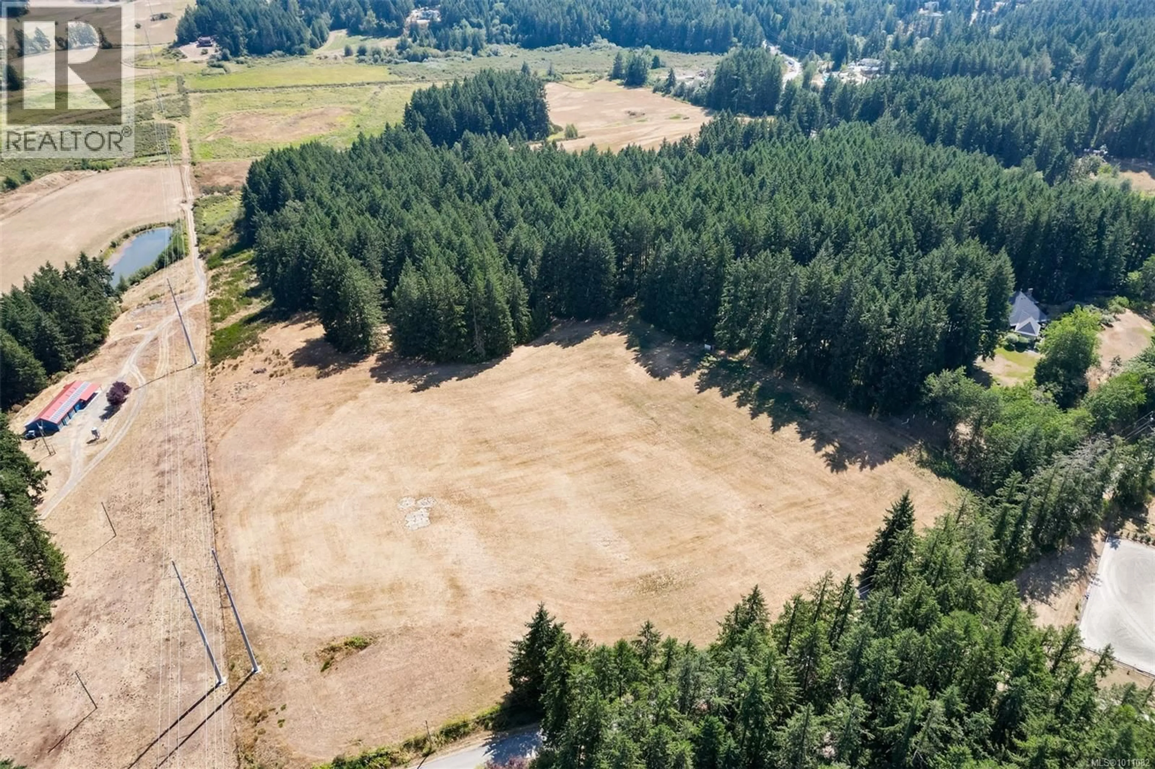 A pic from outside/outdoor area/front of a property/back of a property/a pic from drone, forest/trees view for 7003 MAYS ROAD, Duncan British Columbia V9L6A6