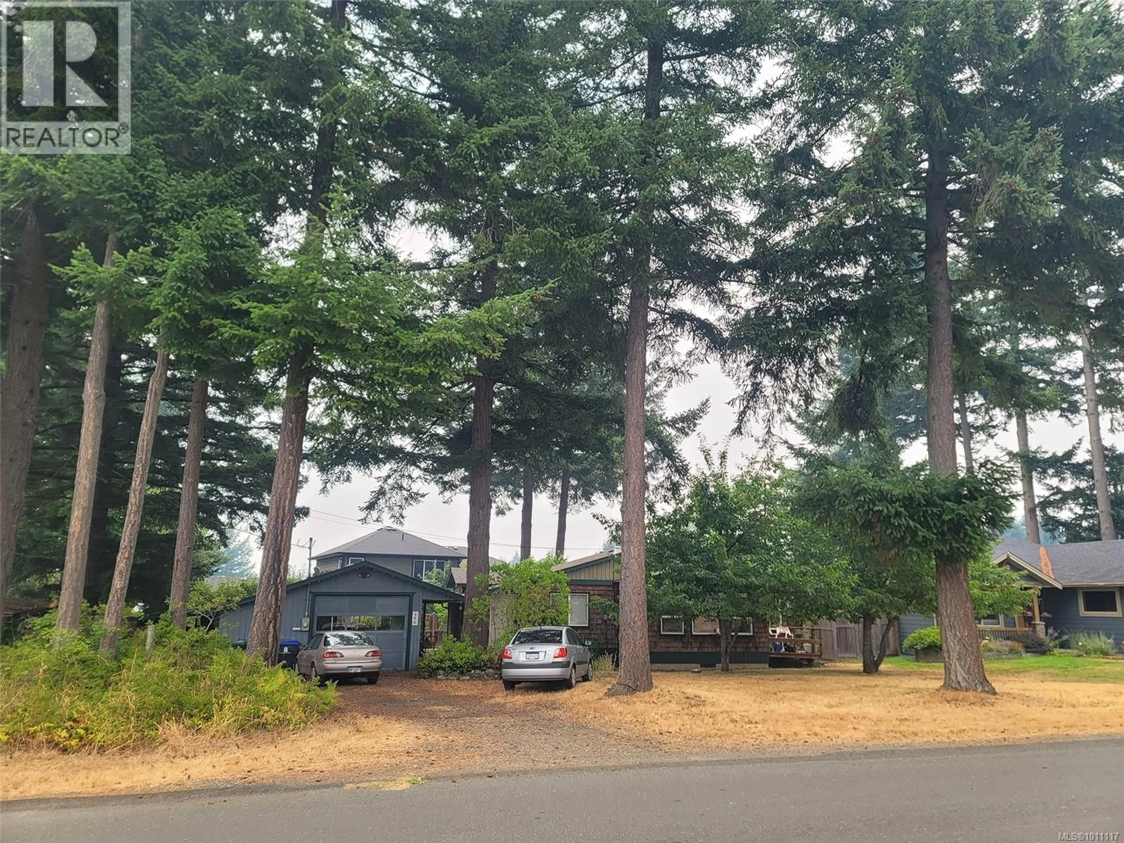 A pic from outside/outdoor area/front of a property/back of a property/a pic from drone, forest/trees view for 496 BUTCHERS ROAD, Comox British Columbia V9M3W6