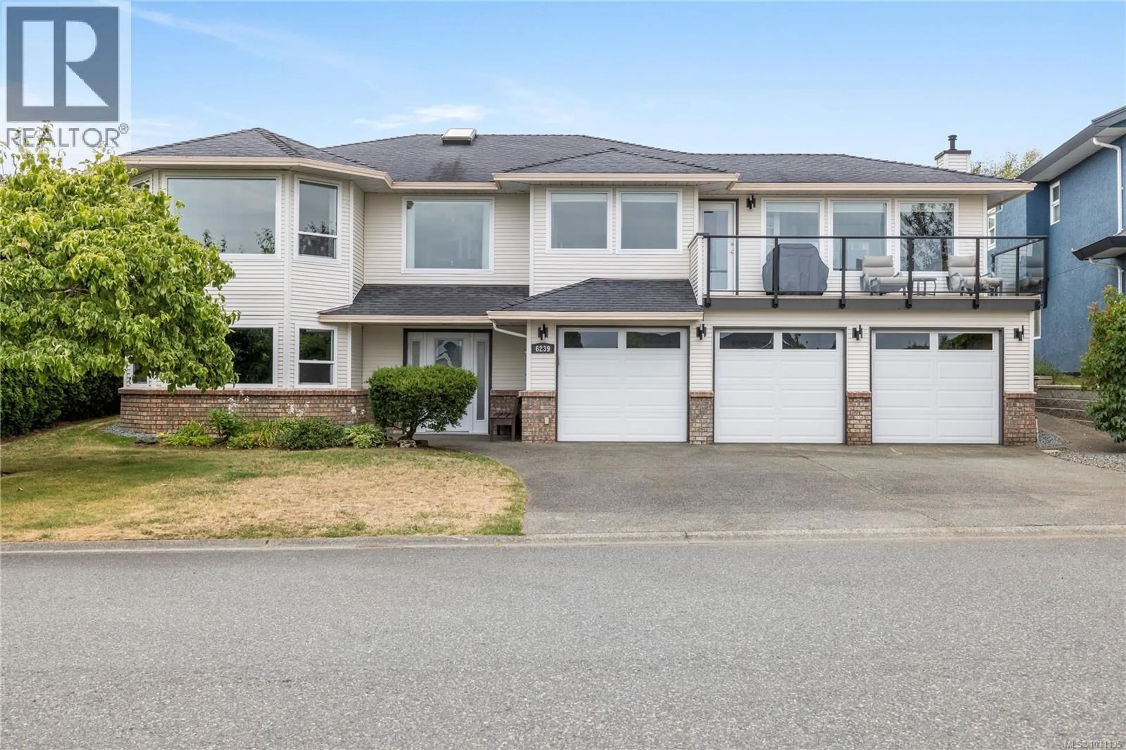 Home with vinyl exterior material, street for 6239 SCOLLOS PLACE, Nanaimo British Columbia V9V1K9