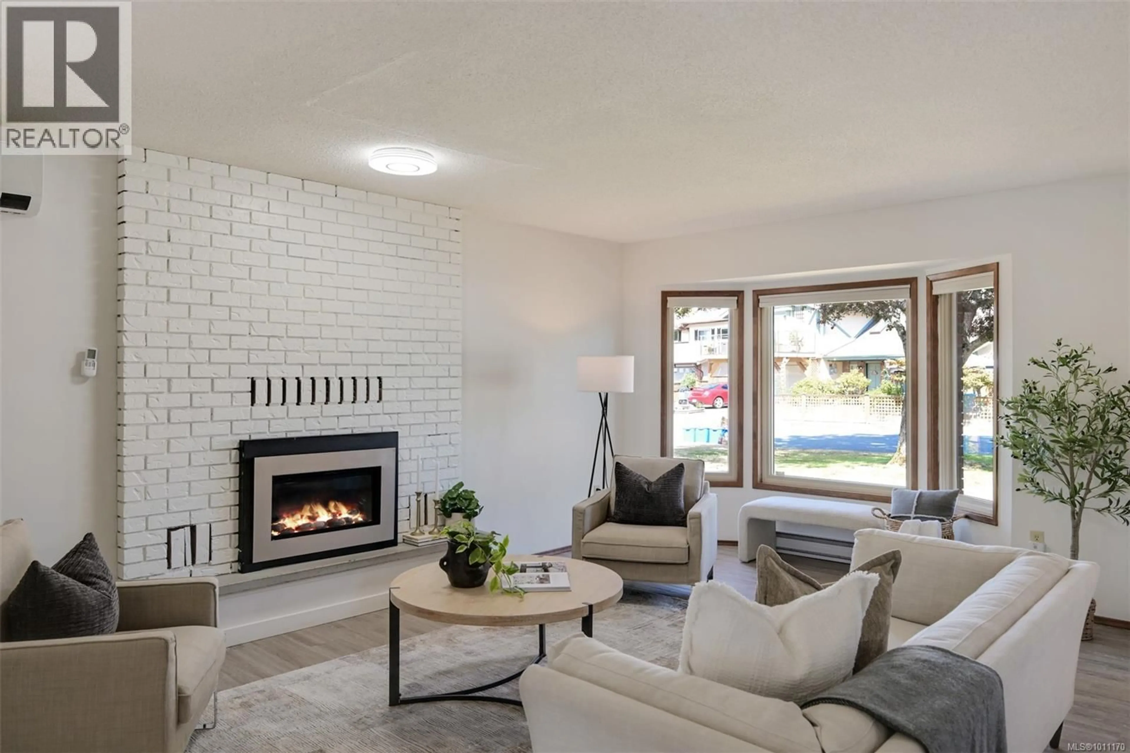 Living room with furniture, ceramic/tile floor for 1551 PRAIRIE STREET, Saanich British Columbia V8N4P4