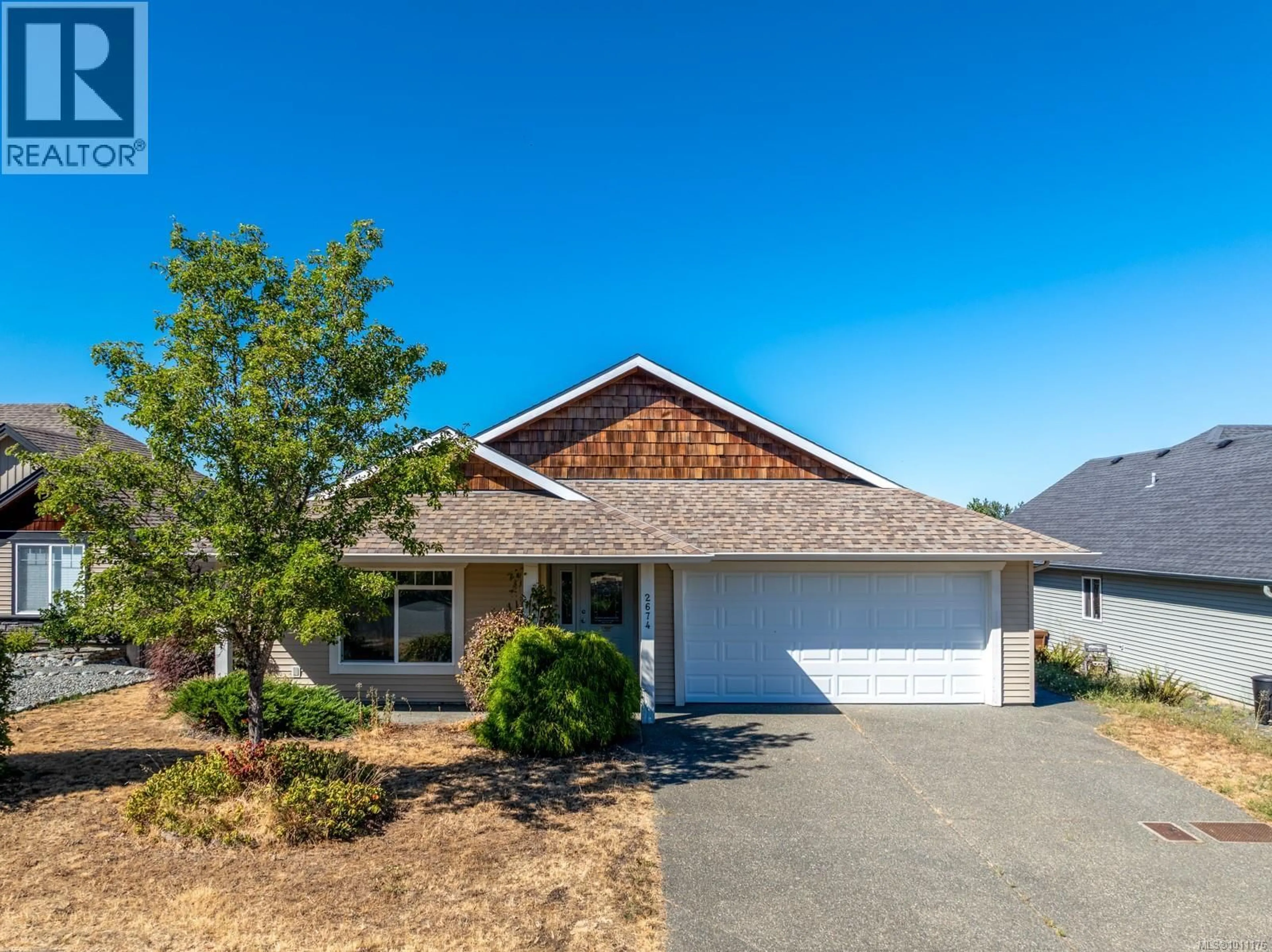Home with vinyl exterior material, street for 2674 RYDAL AVENUE, Cumberland British Columbia V0R1S0