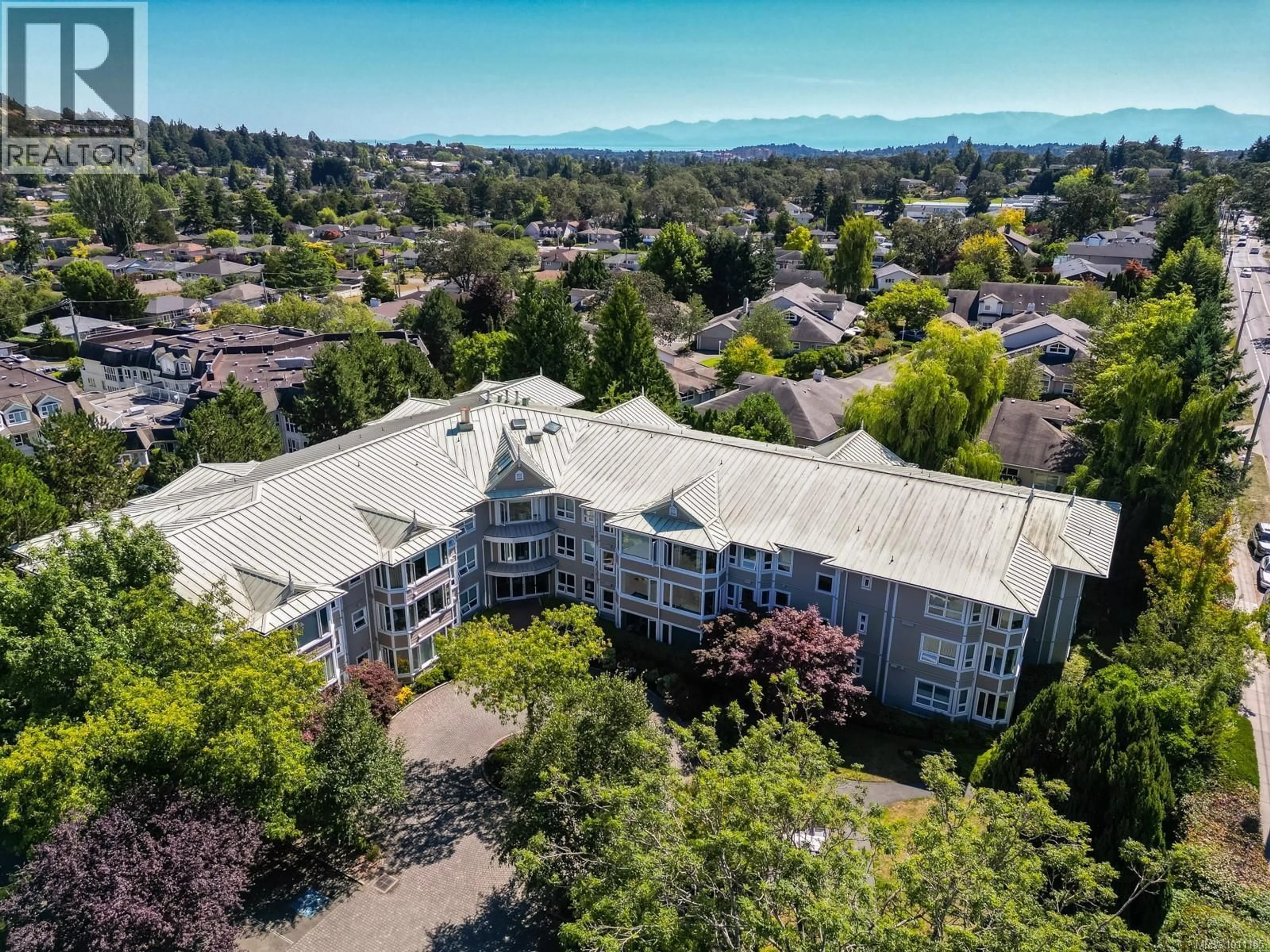 A pic from outside/outdoor area/front of a property/back of a property/a pic from drone, mountain view for 107 - 1505 CHURCH AVENUE, Saanich British Columbia V8P2G7