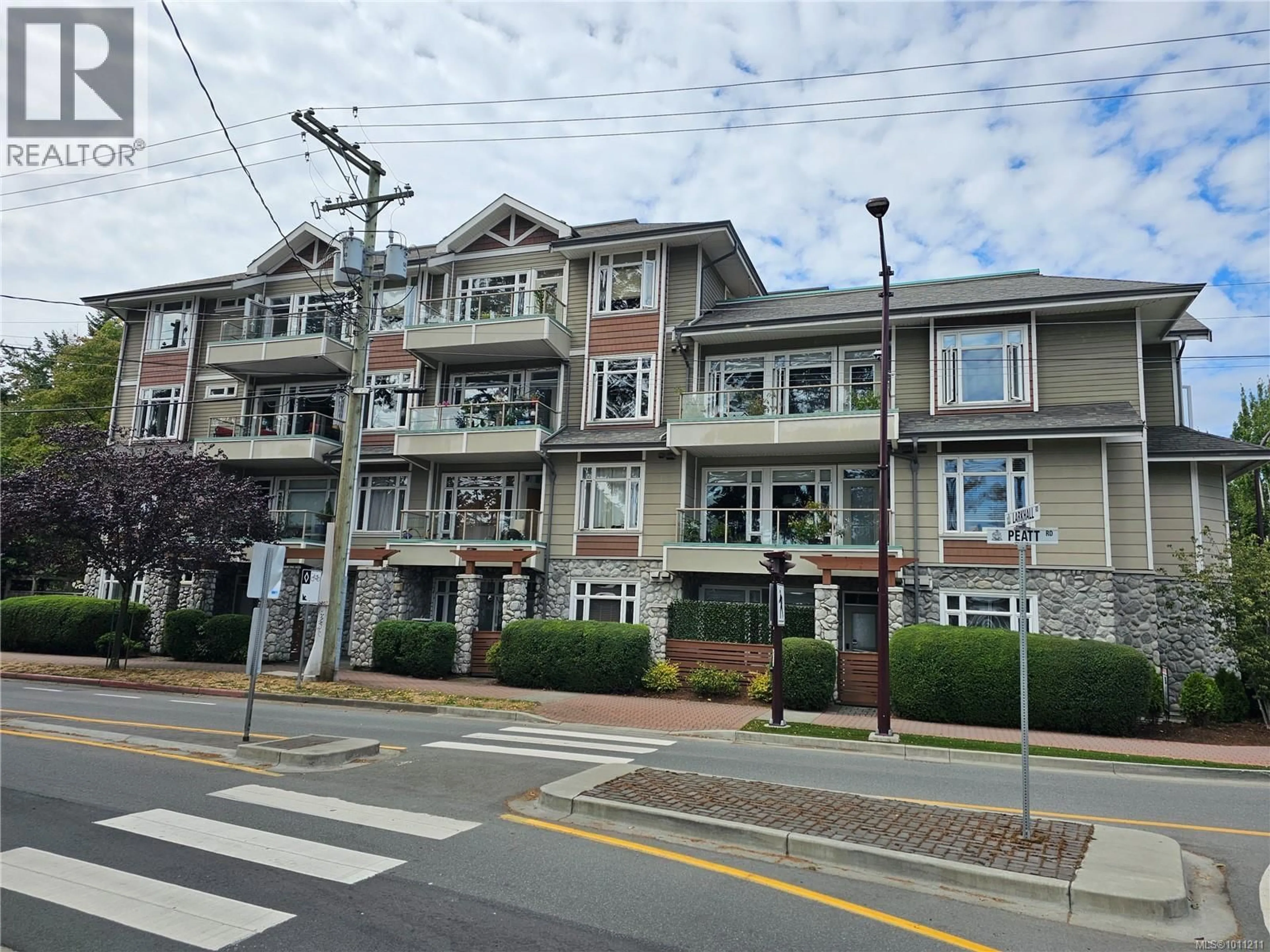 A pic from outside/outdoor area/front of a property/back of a property/a pic from drone, street for 306 - 2706 PEATT ROAD, Langford British Columbia V9B3V3