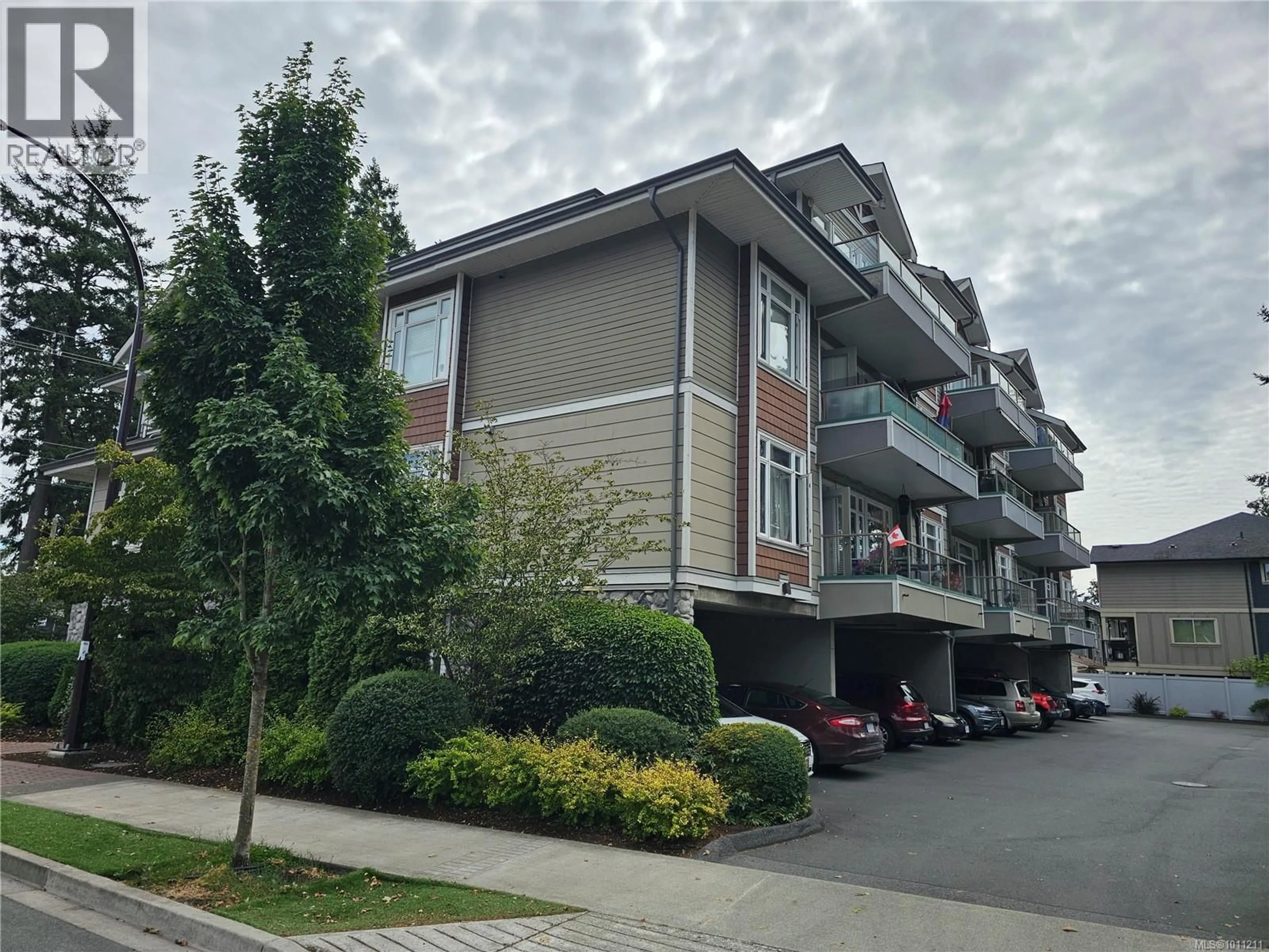 A pic from outside/outdoor area/front of a property/back of a property/a pic from drone, street for 306 - 2706 PEATT ROAD, Langford British Columbia V9B3V3