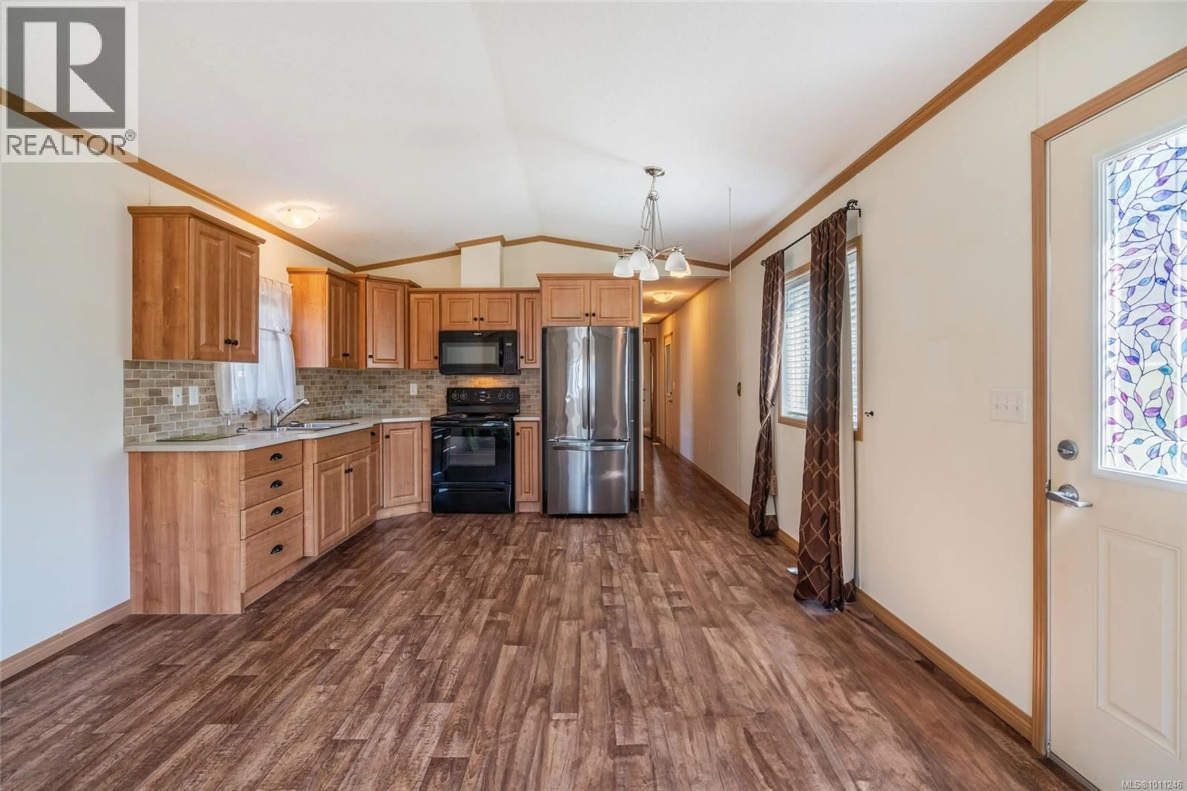 Open concept kitchen, wood/laminate floor for 26 - 6820 PARKLANDS PLACE, Lantzville British Columbia V0R2H0