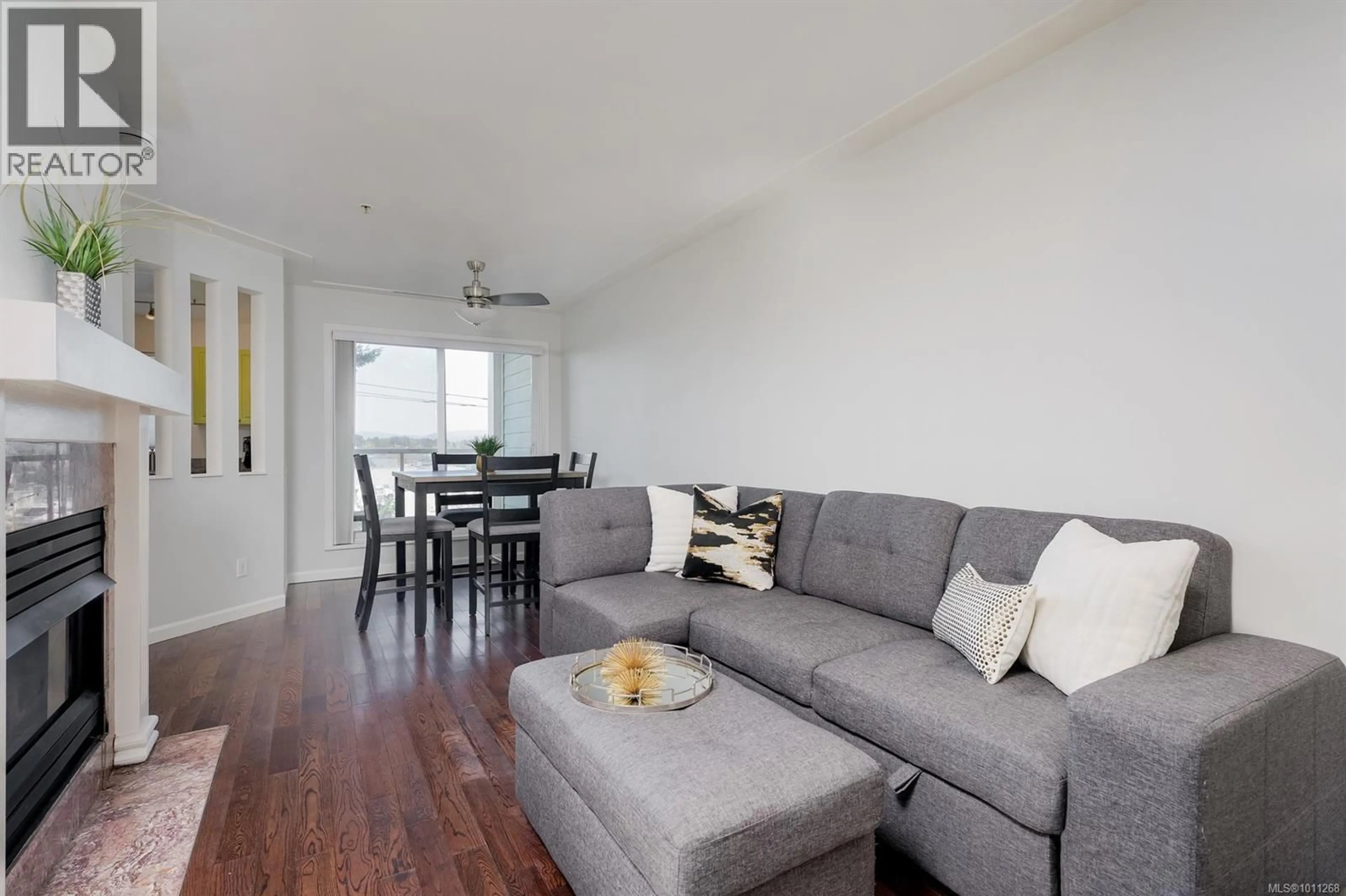 Living room with furniture, wood/laminate floor for 308 - 649 BAY STREET, Victoria British Columbia V8T5H8