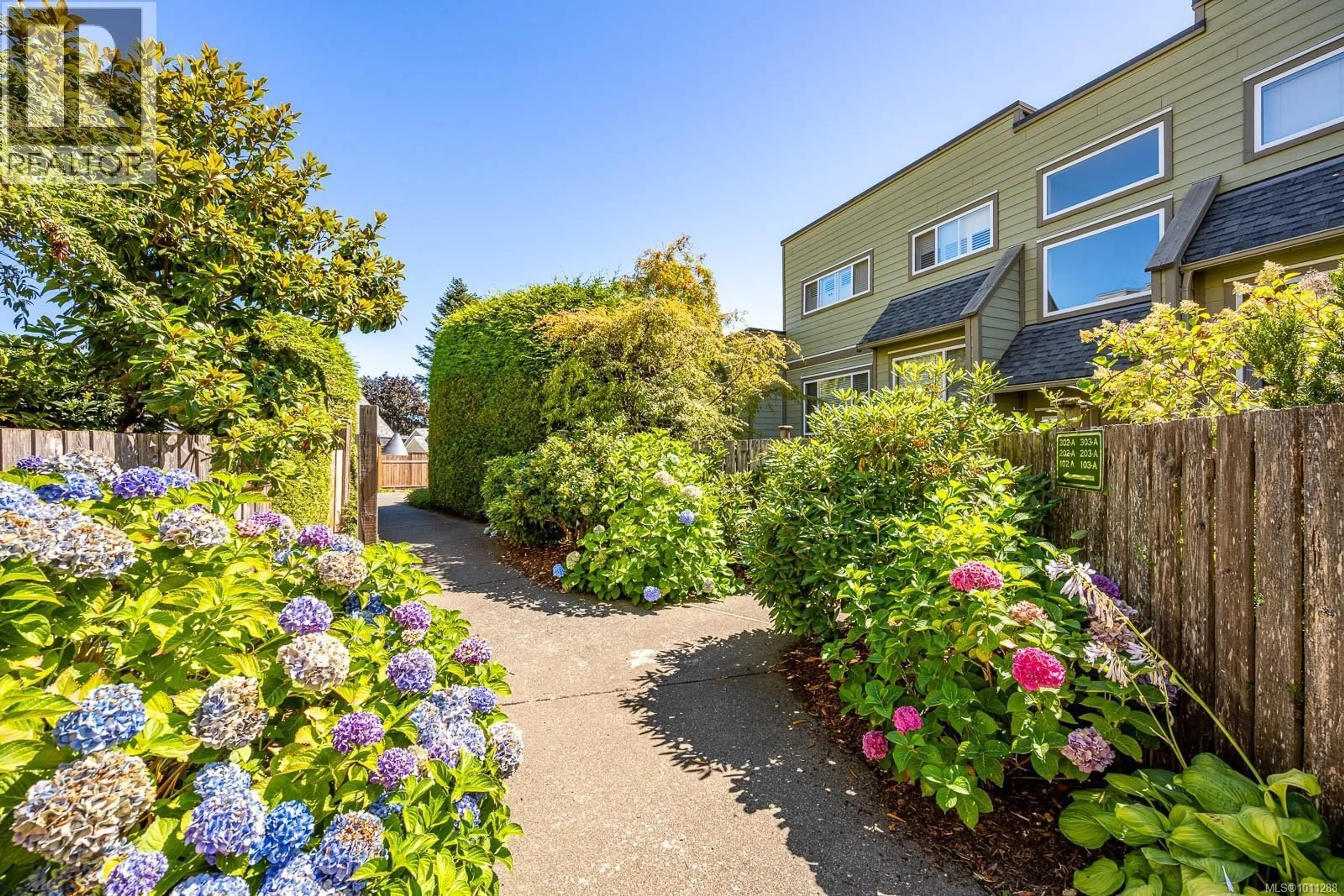 A pic from outside/outdoor area/front of a property/back of a property/a pic from drone, street for 203 - 2250 MANOR PLACE, Comox British Columbia V9M1C5