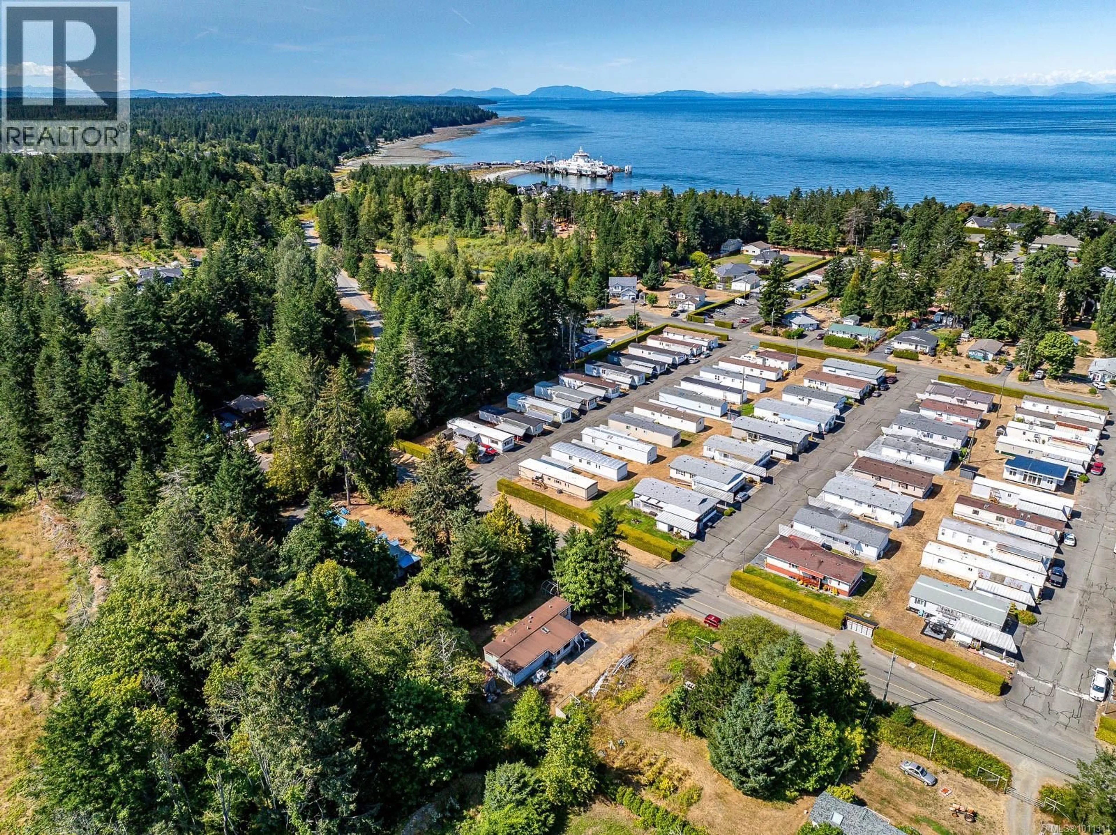 A pic from outside/outdoor area/front of a property/back of a property/a pic from drone, water/lake/river/ocean view for 1255 WILKINSON ROAD, Comox British Columbia V9M4B8