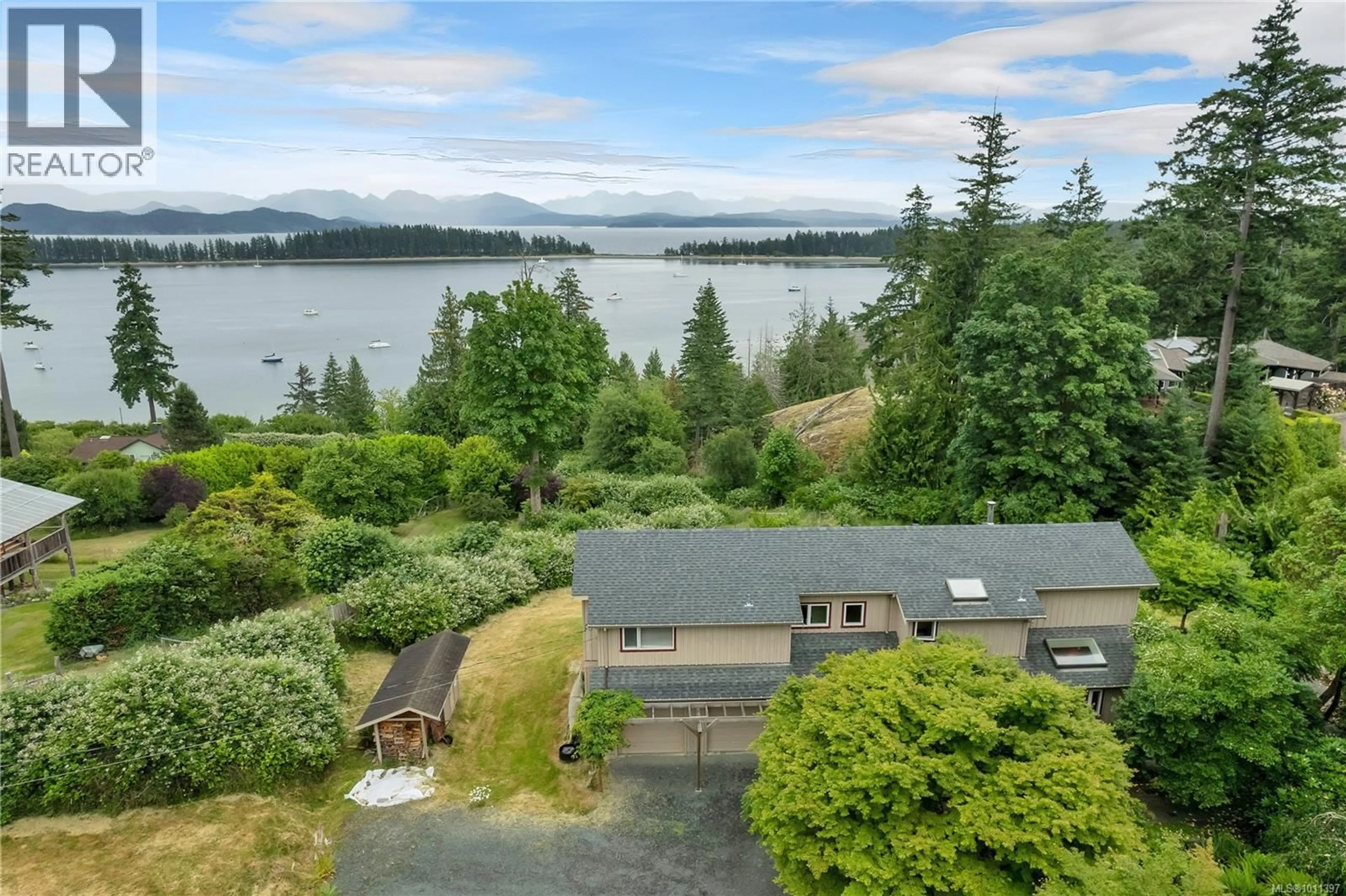 A pic from outside/outdoor area/front of a property/back of a property/a pic from drone, water/lake/river/ocean view for 1418 SCHOONER ROAD, Quadra Island British Columbia V0P1H0