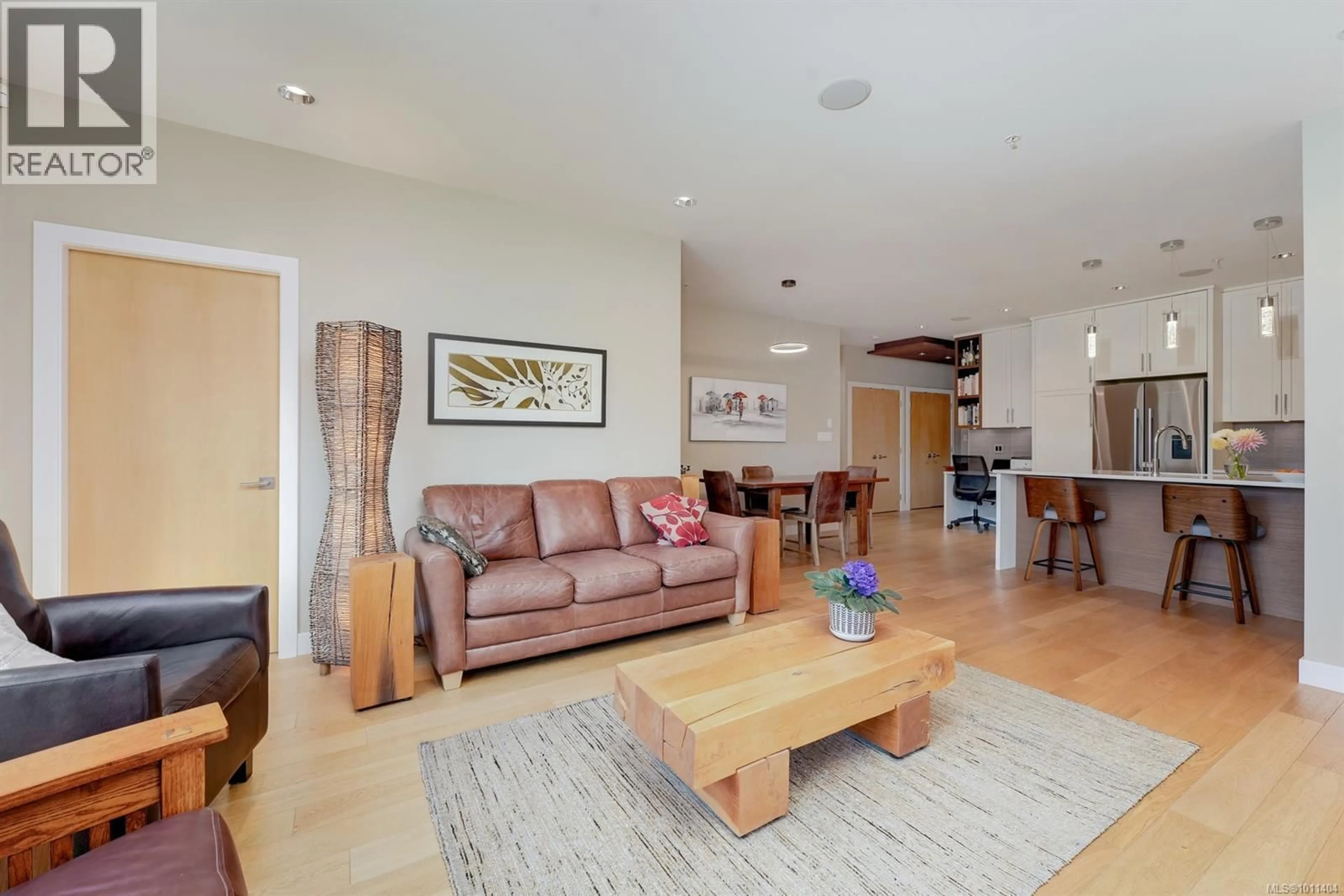 Living room with furniture, wood/laminate floor for 202 - 1969 OAK BAY AVENUE, Victoria British Columbia V8R1E3