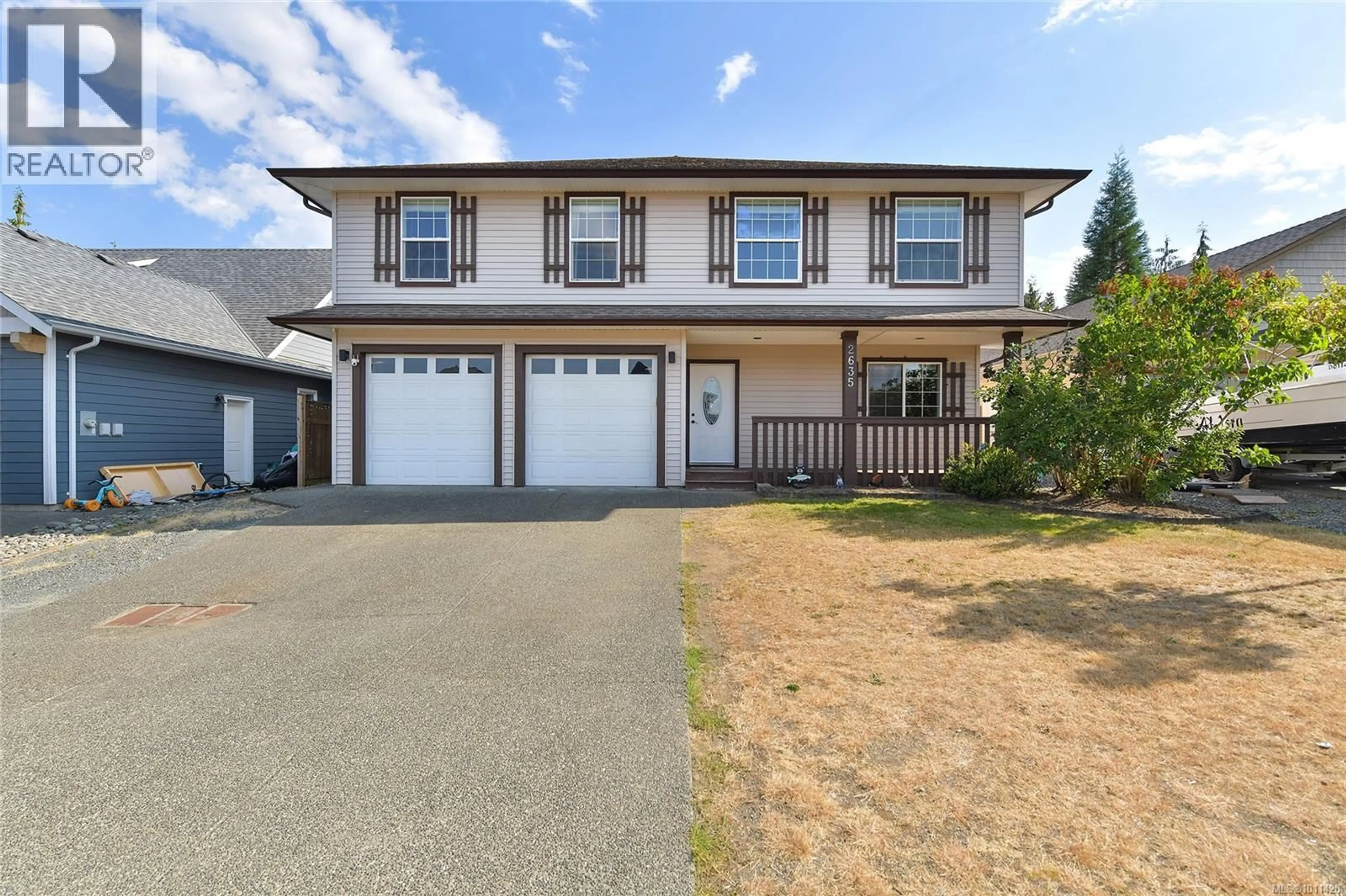 Home with vinyl exterior material, street for 2635 RYDAL AVENUE, Cumberland British Columbia V0R1S0