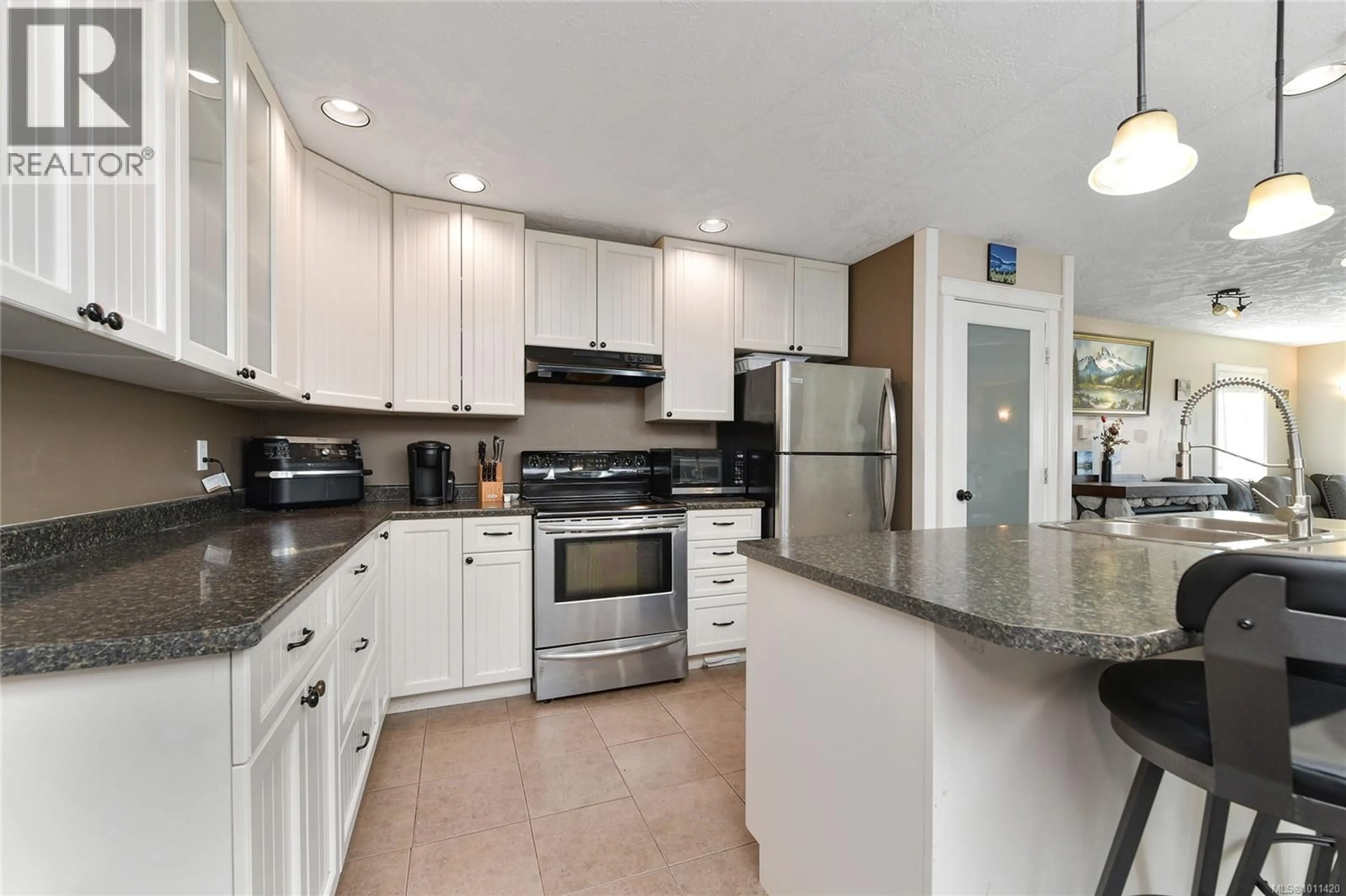Open concept kitchen, ceramic/tile floor for 2635 RYDAL AVENUE, Cumberland British Columbia V0R1S0