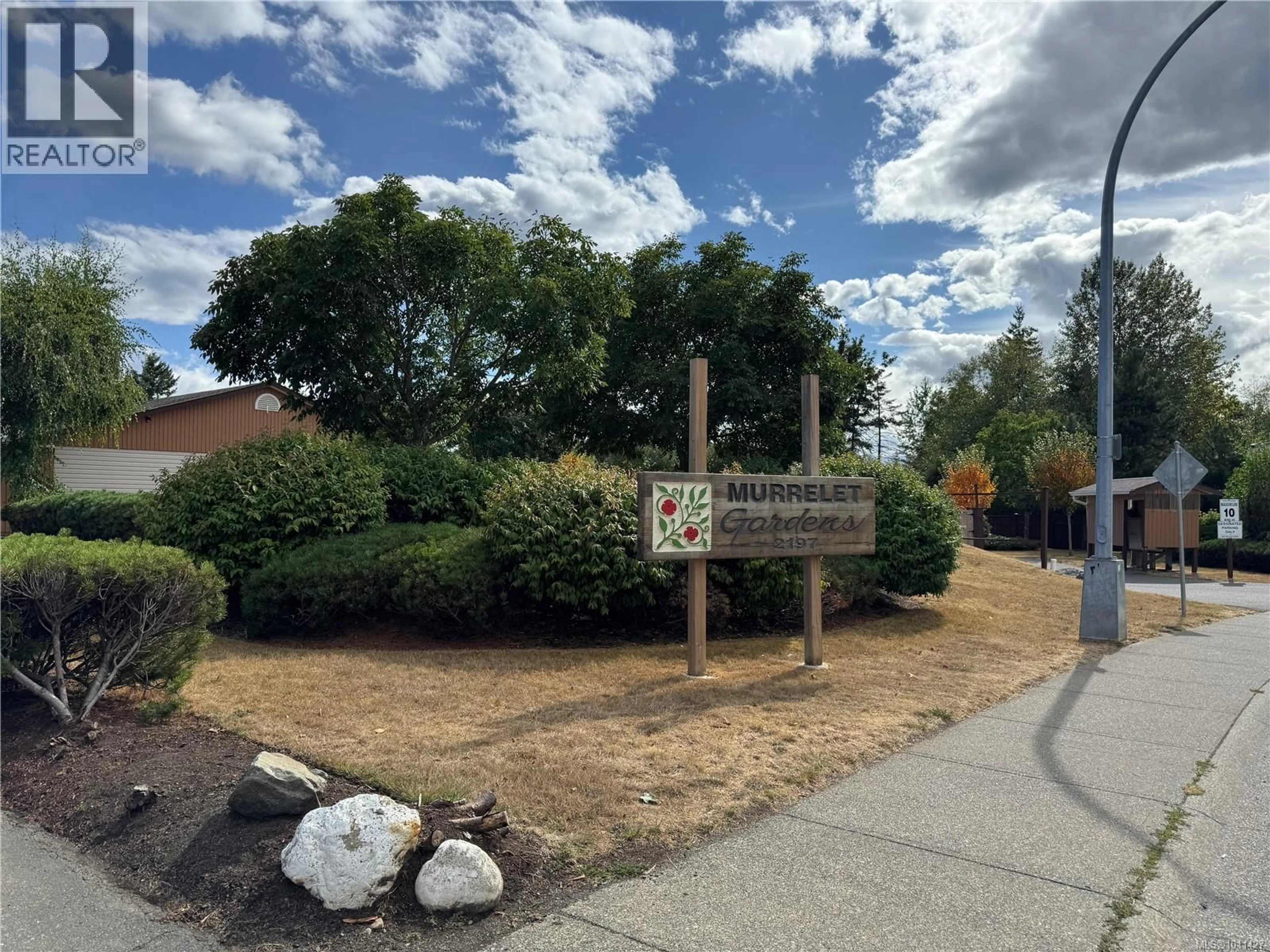 A pic from outside/outdoor area/front of a property/back of a property/a pic from drone, street for 23 - 2197 MURRELET DRIVE, Comox British Columbia V9M3Y1