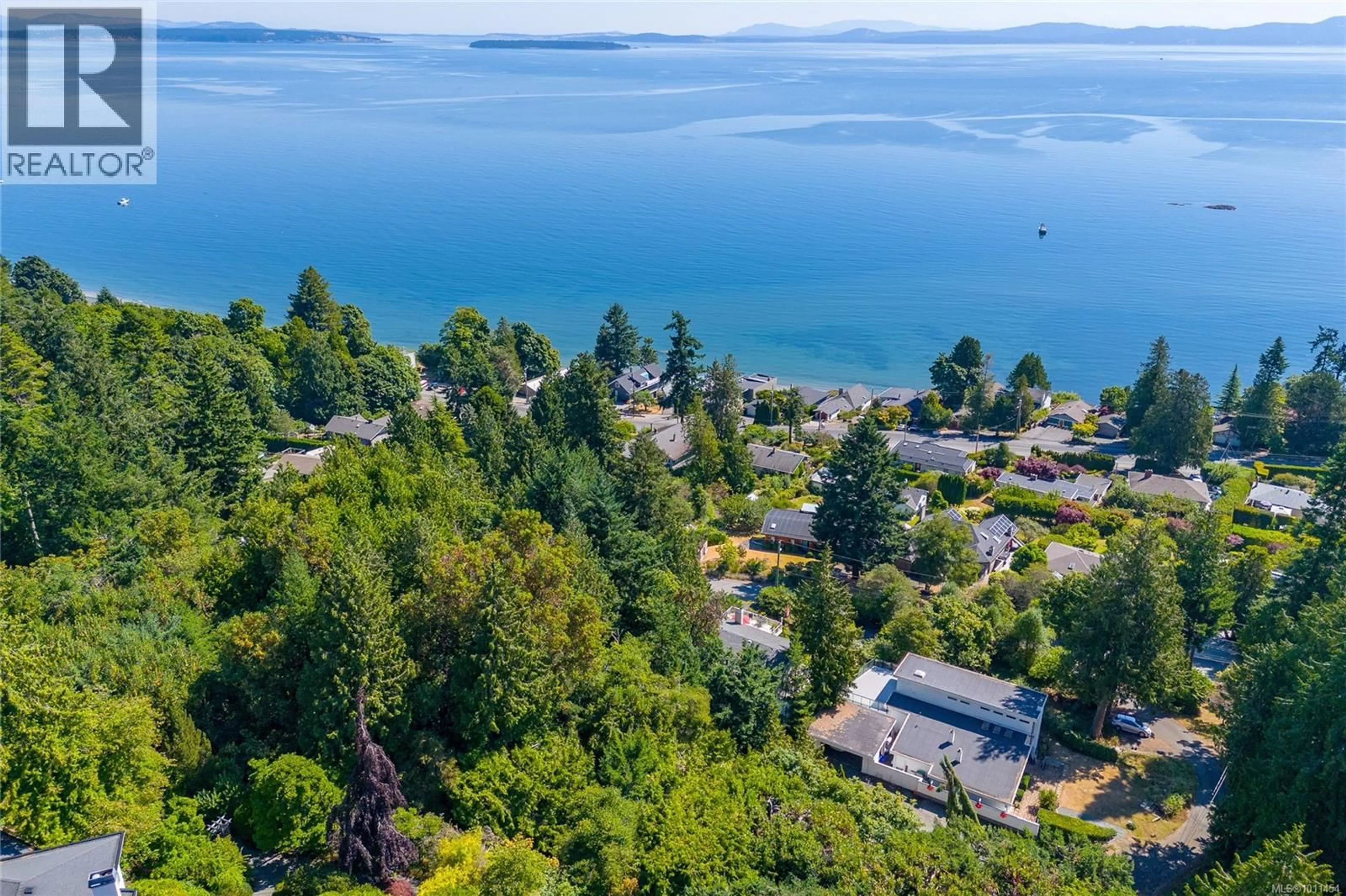 A pic from outside/outdoor area/front of a property/back of a property/a pic from drone, water/lake/river/ocean view for 4964 LOCHSIDE DRIVE, Saanich British Columbia V8Y2E4