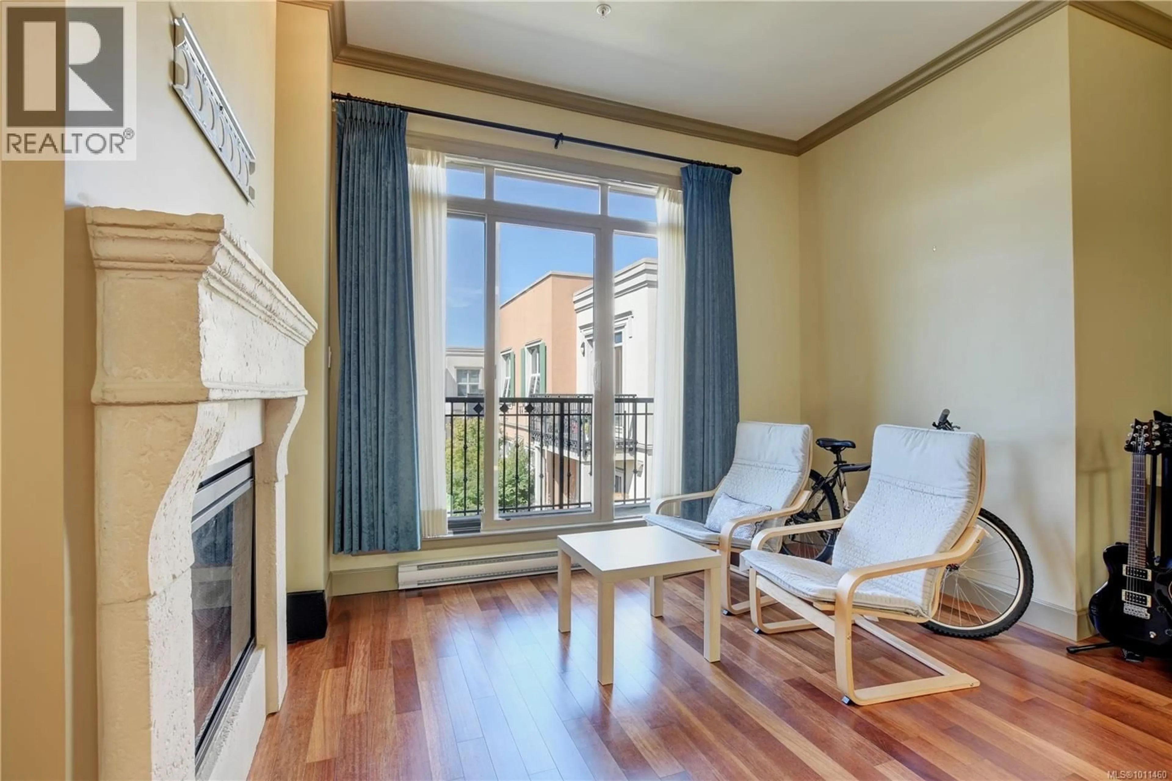 Living room with furniture, wood/laminate floor for 405 - 1620 MCKENZIE AVENUE, Saanich British Columbia V8N0A1