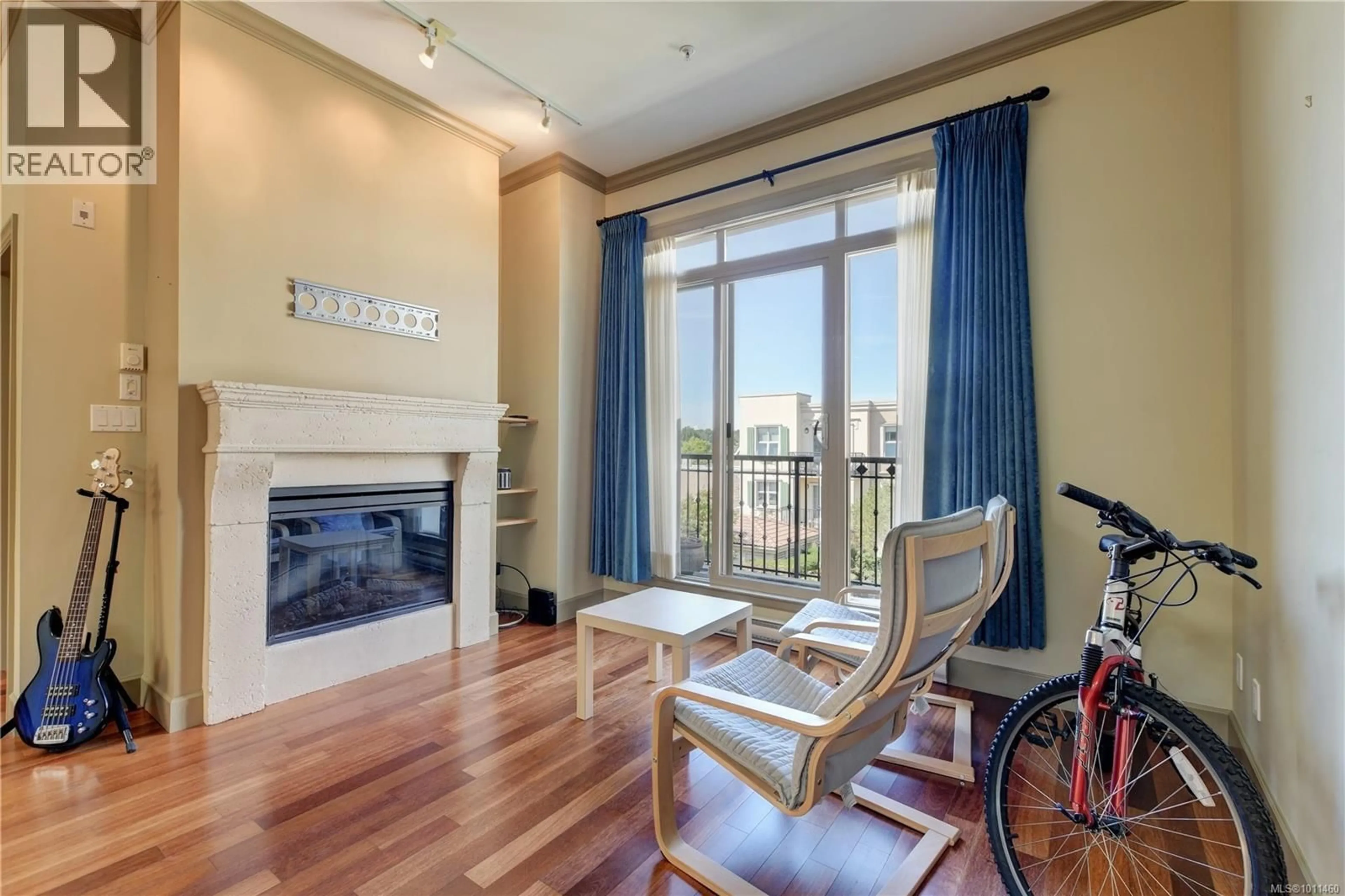 Living room with furniture, wood/laminate floor for 405 - 1620 MCKENZIE AVENUE, Saanich British Columbia V8N0A1