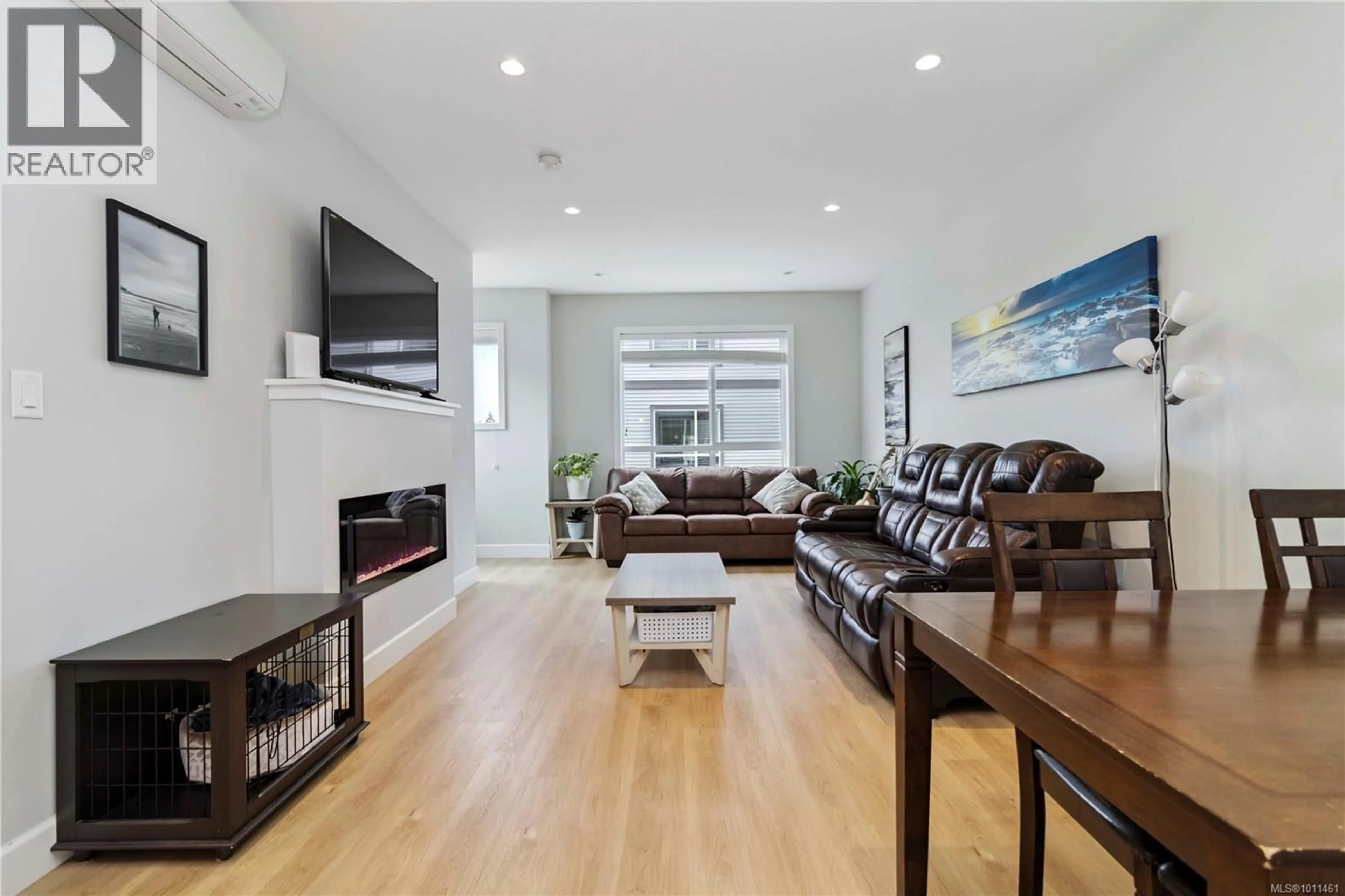 Living room with furniture, wood/laminate floor for 605 - 3351 LUXTON ROAD, Langford British Columbia V9C0P2