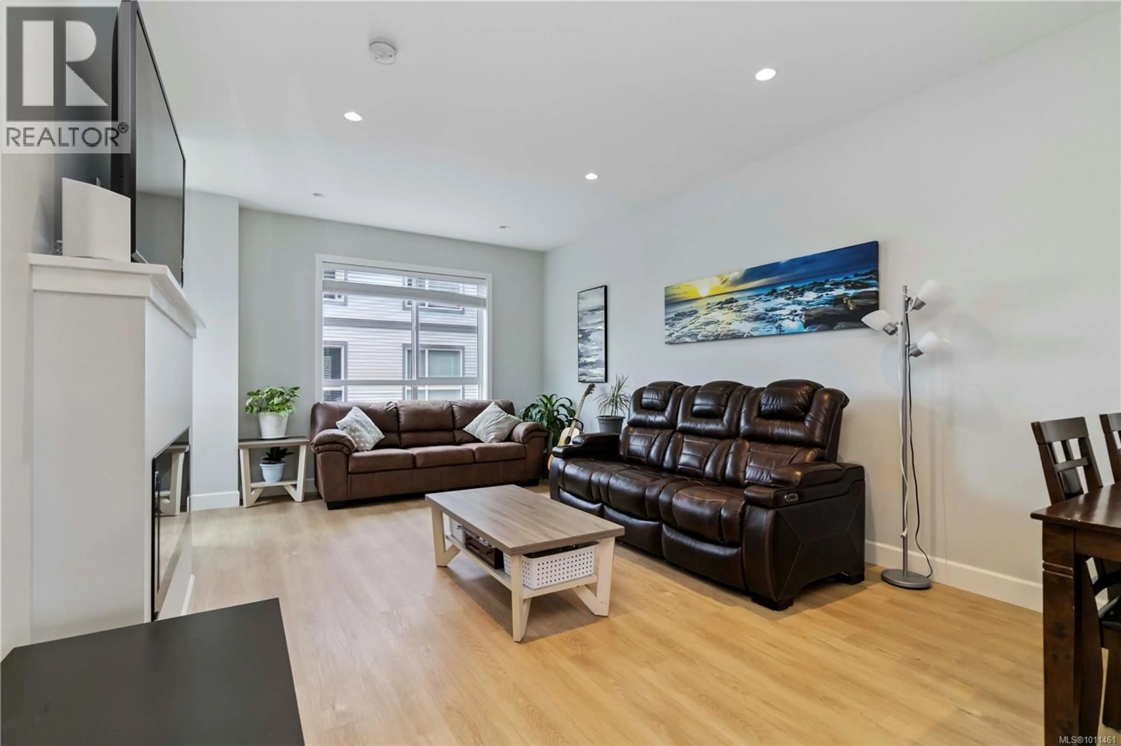 Living room with furniture, wood/laminate floor for 605 - 3351 LUXTON ROAD, Langford British Columbia V9C0P2